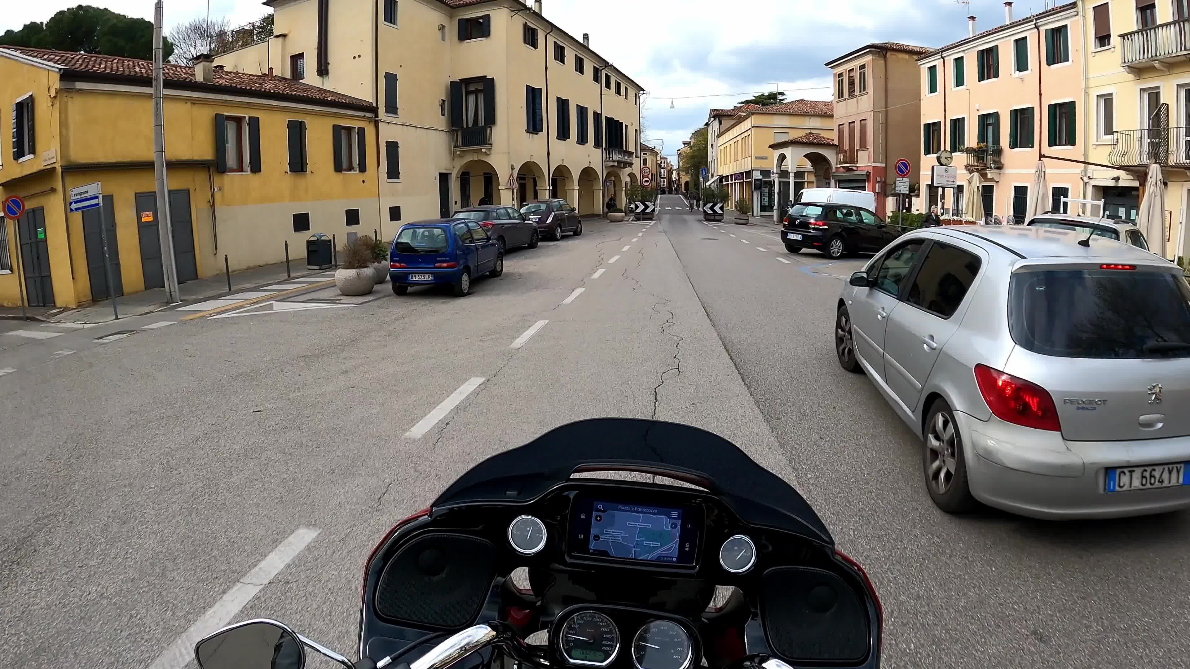 Timewarp of a man driving a Harley Davidson for the roads of Padova