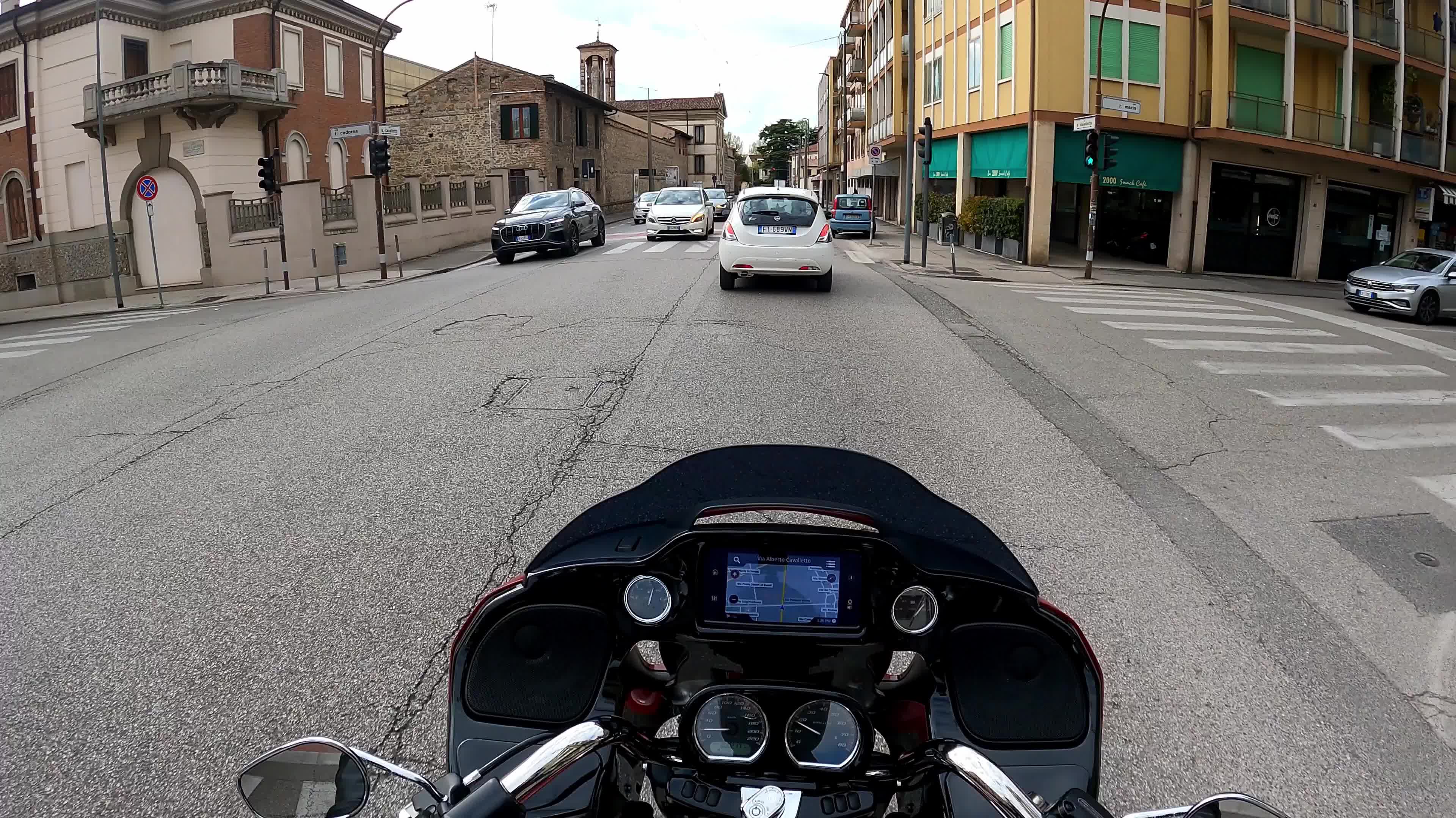 Timewarp of a man driving a Harley Davidson for the roads of Padova