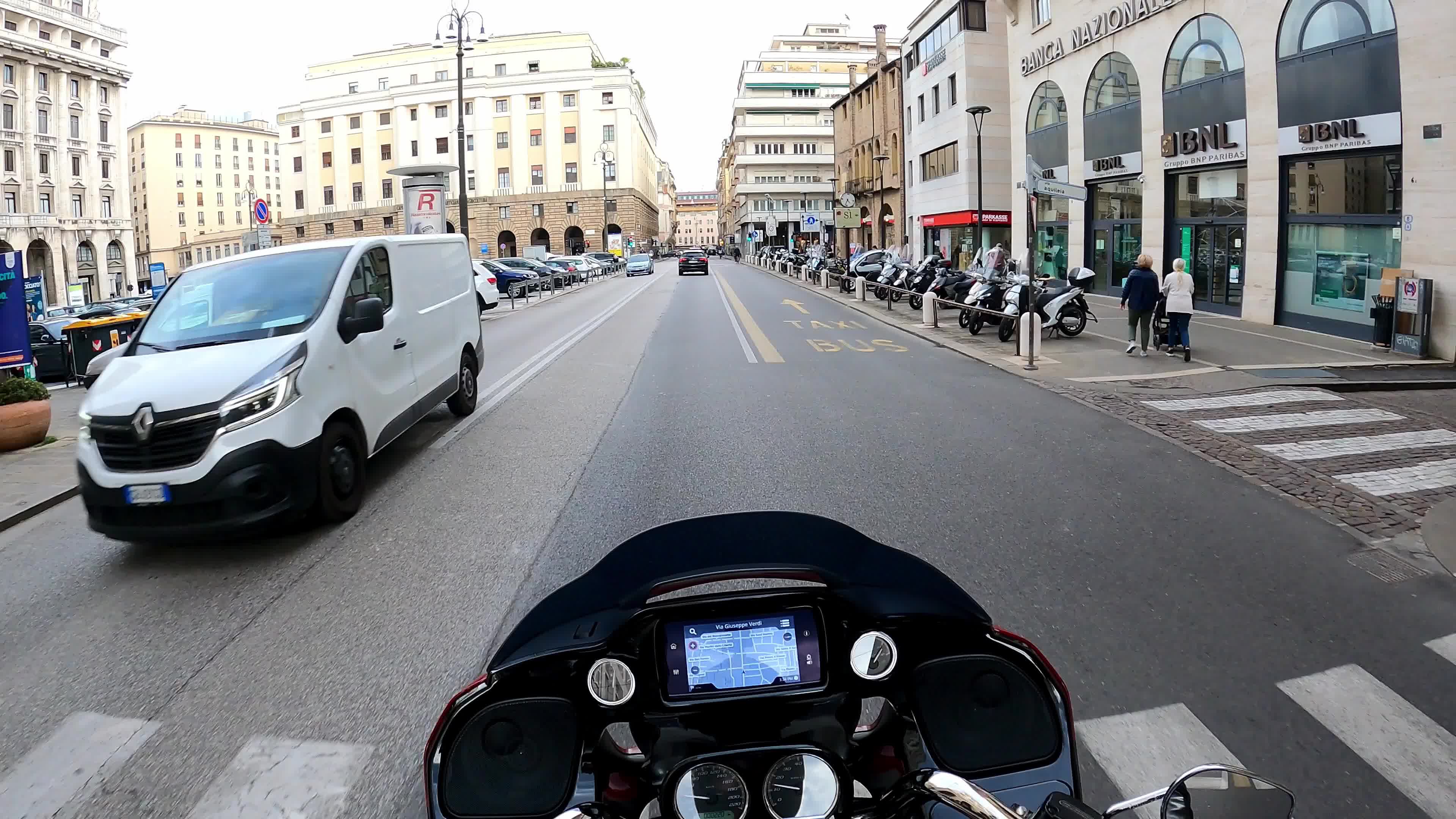 Timewarp of a man driving a Harley Davidson for the roads of Padova