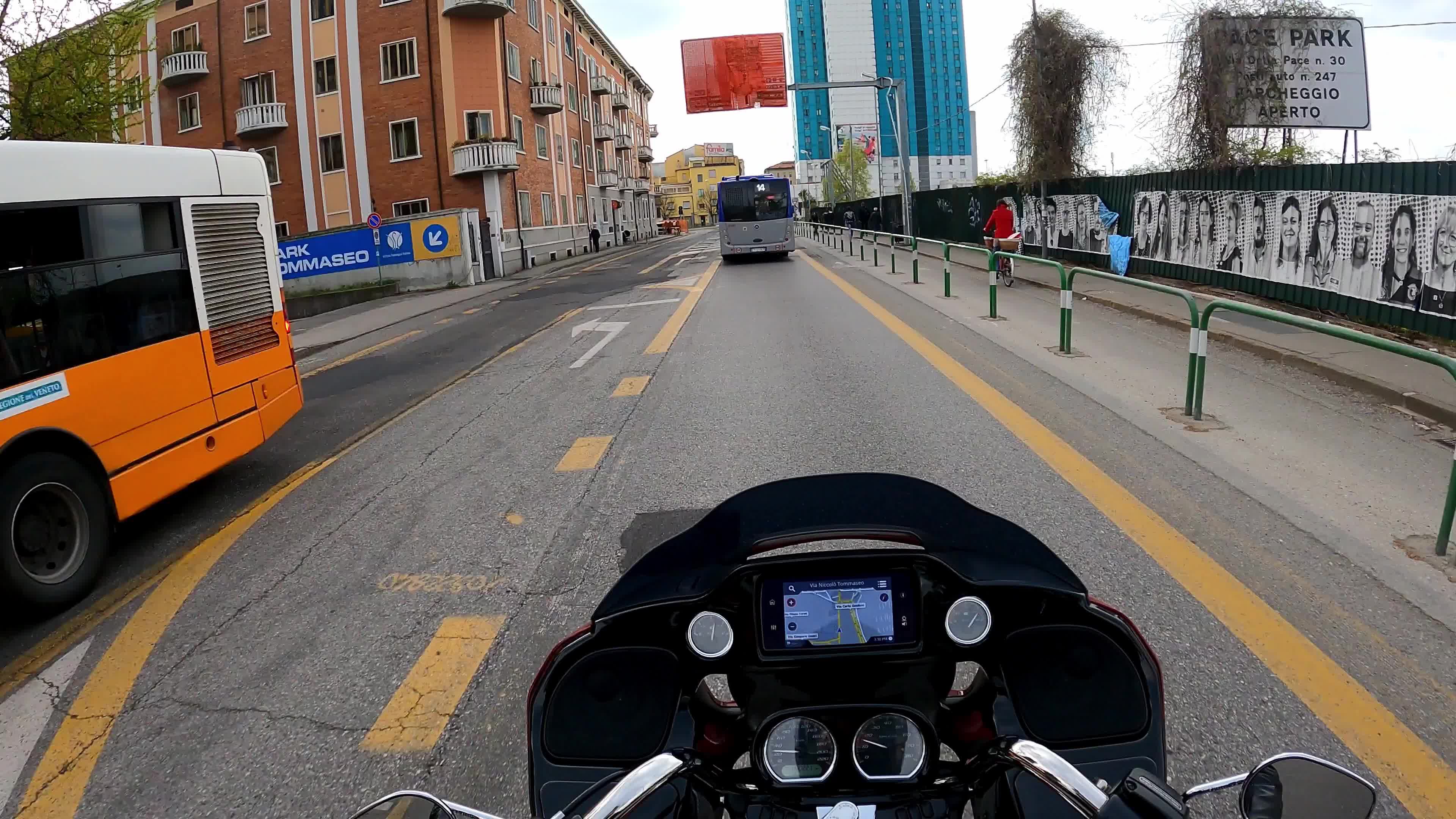 Timewarp of a man driving a Harley Davidson for the roads of Padova