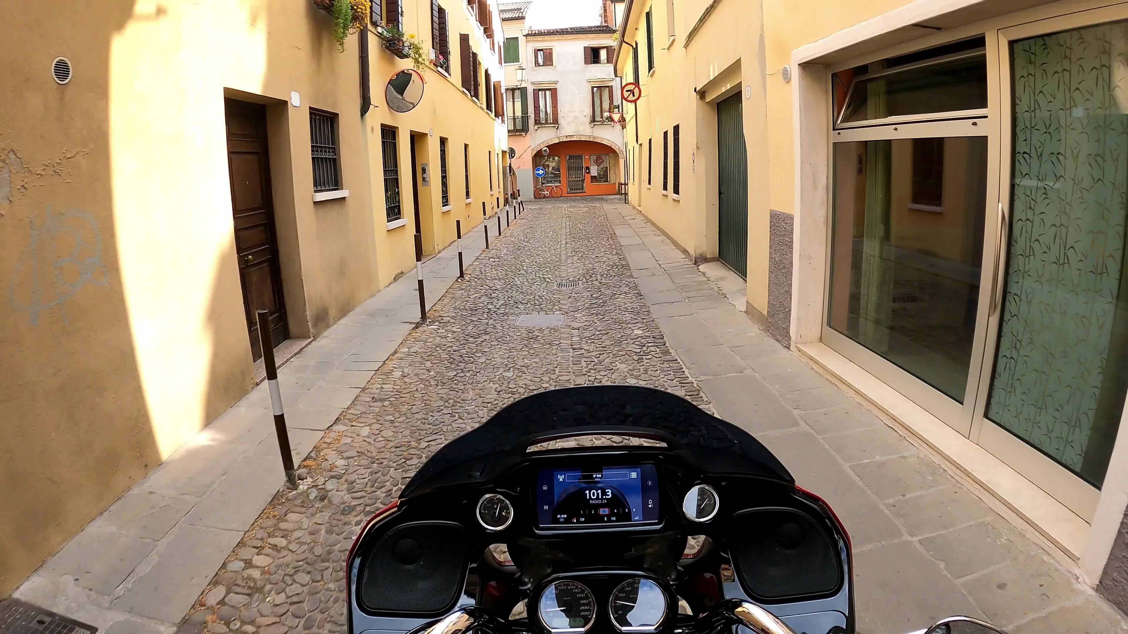 Timewarp of a man driving a Harley Davidson for the roads of Padova