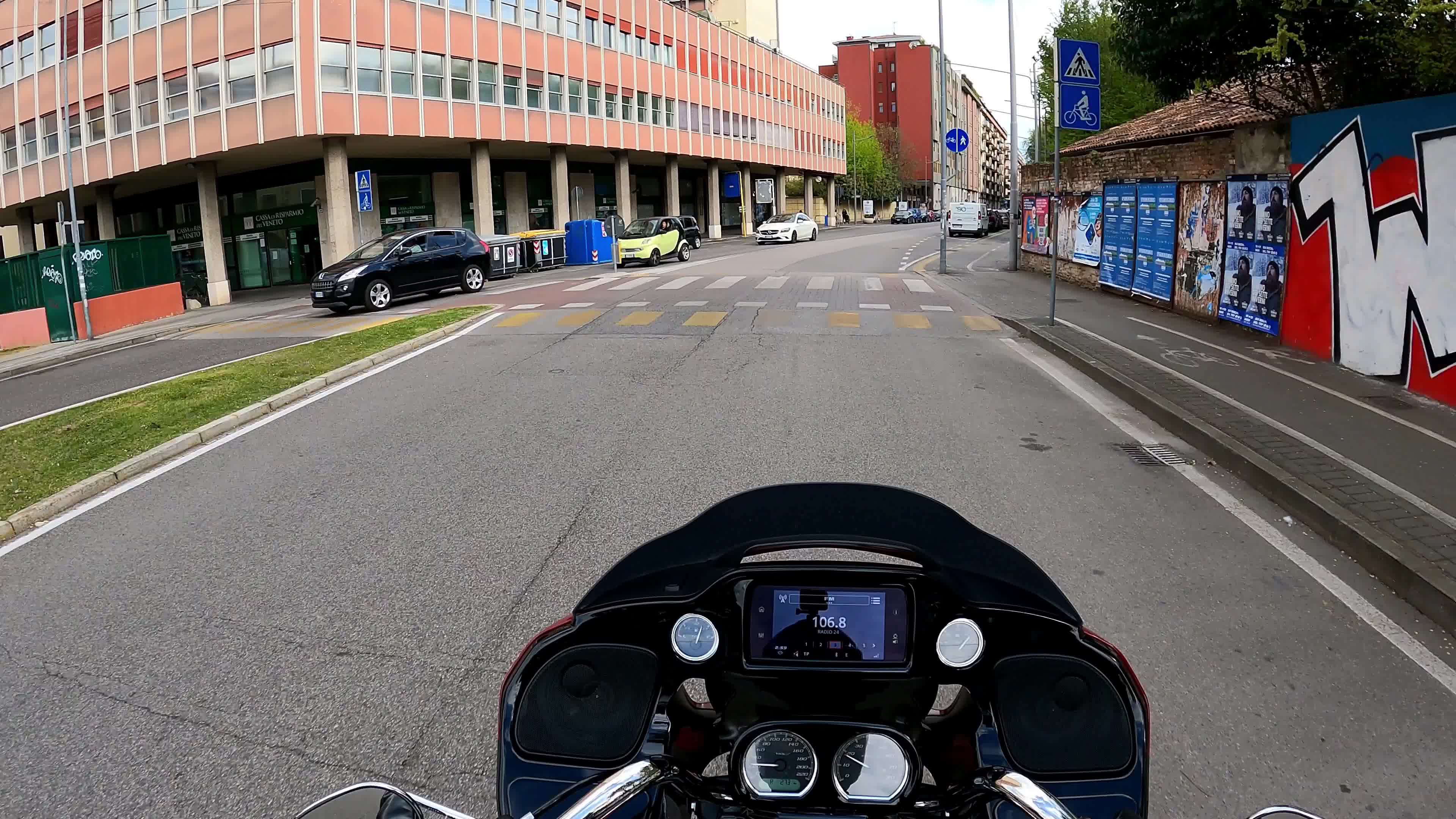 Timewarp of a man driving a Harley Davidson for the roads of Padova