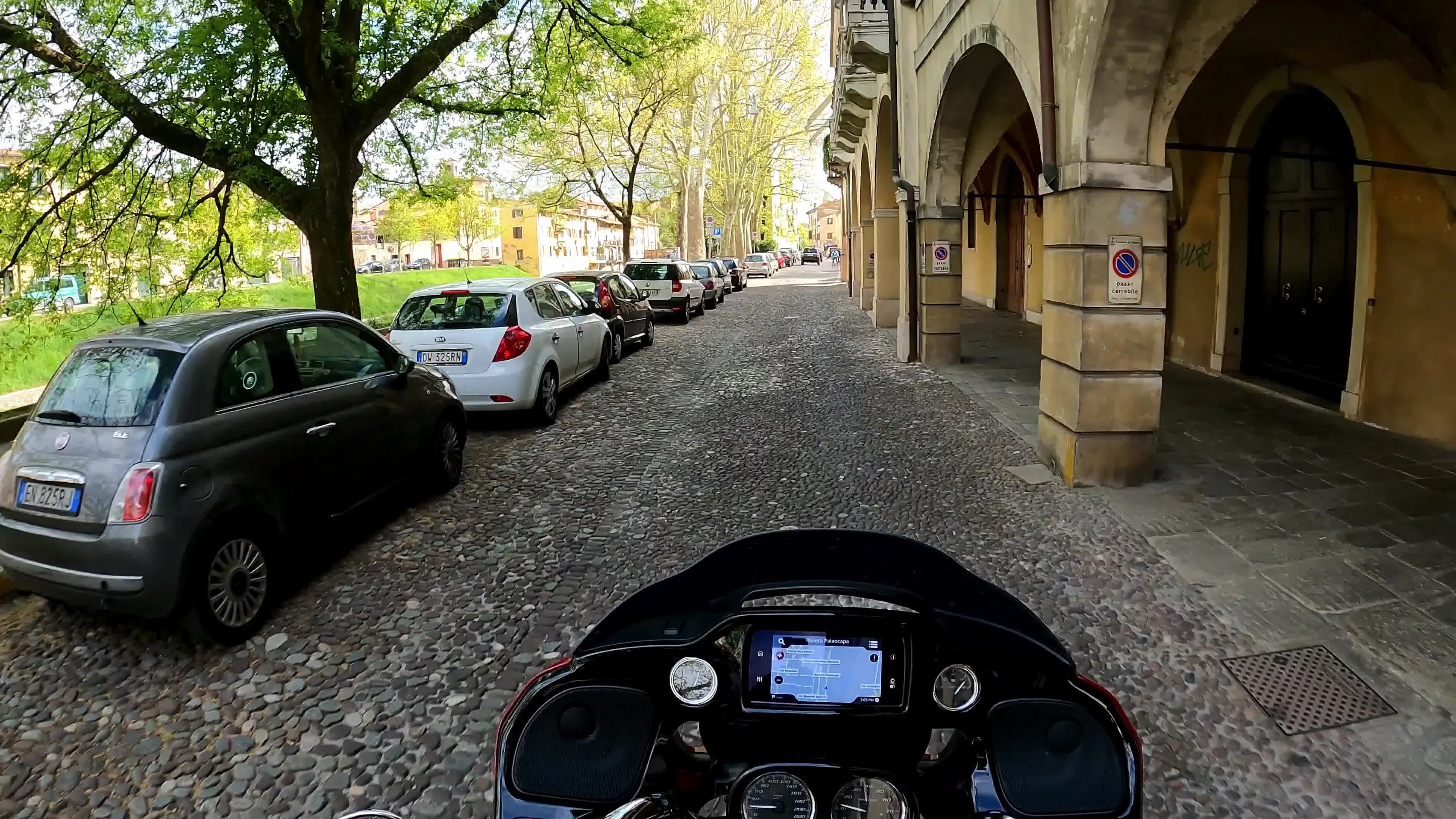 Timewarp of a man driving a Harley Davidson for the roads of Padova
