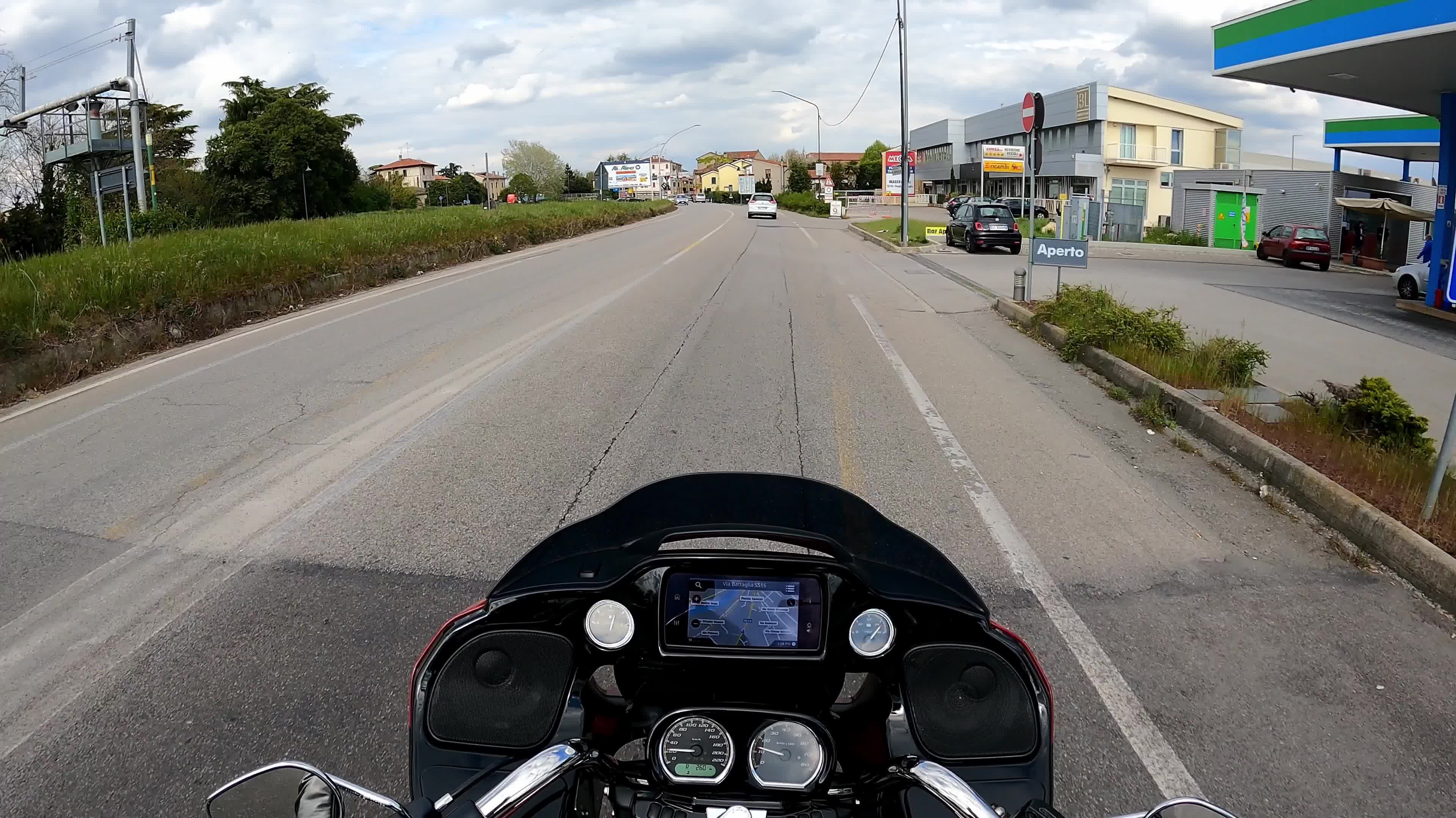 Timewarp of a man driving a Harley Davidson for the roads of Padova