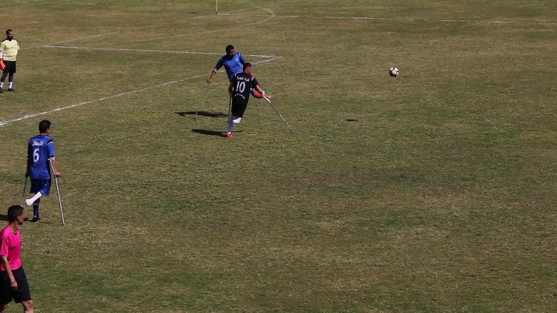 Palestinian amputees play soccer during a local championship in Gaza