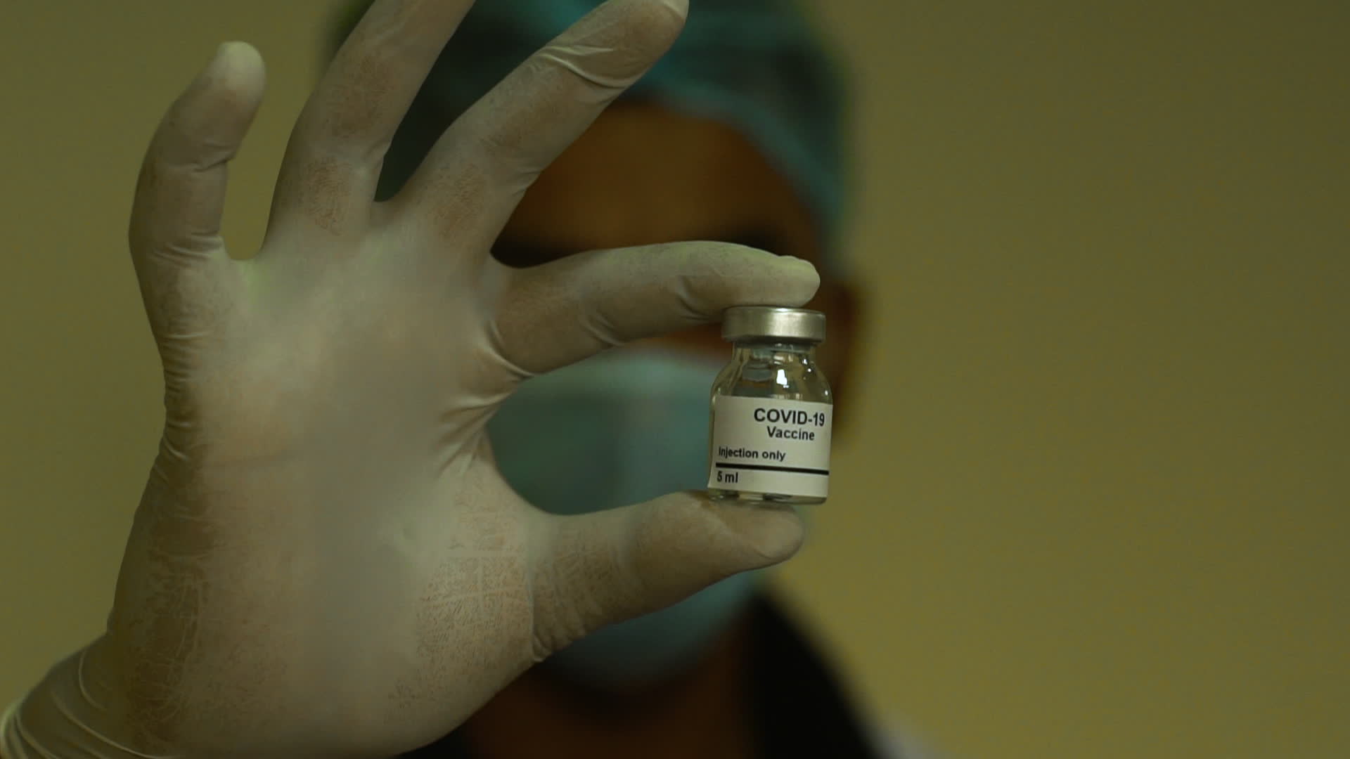 Medical Professionals with a vial of the COVID-19 Vaccine - stock video