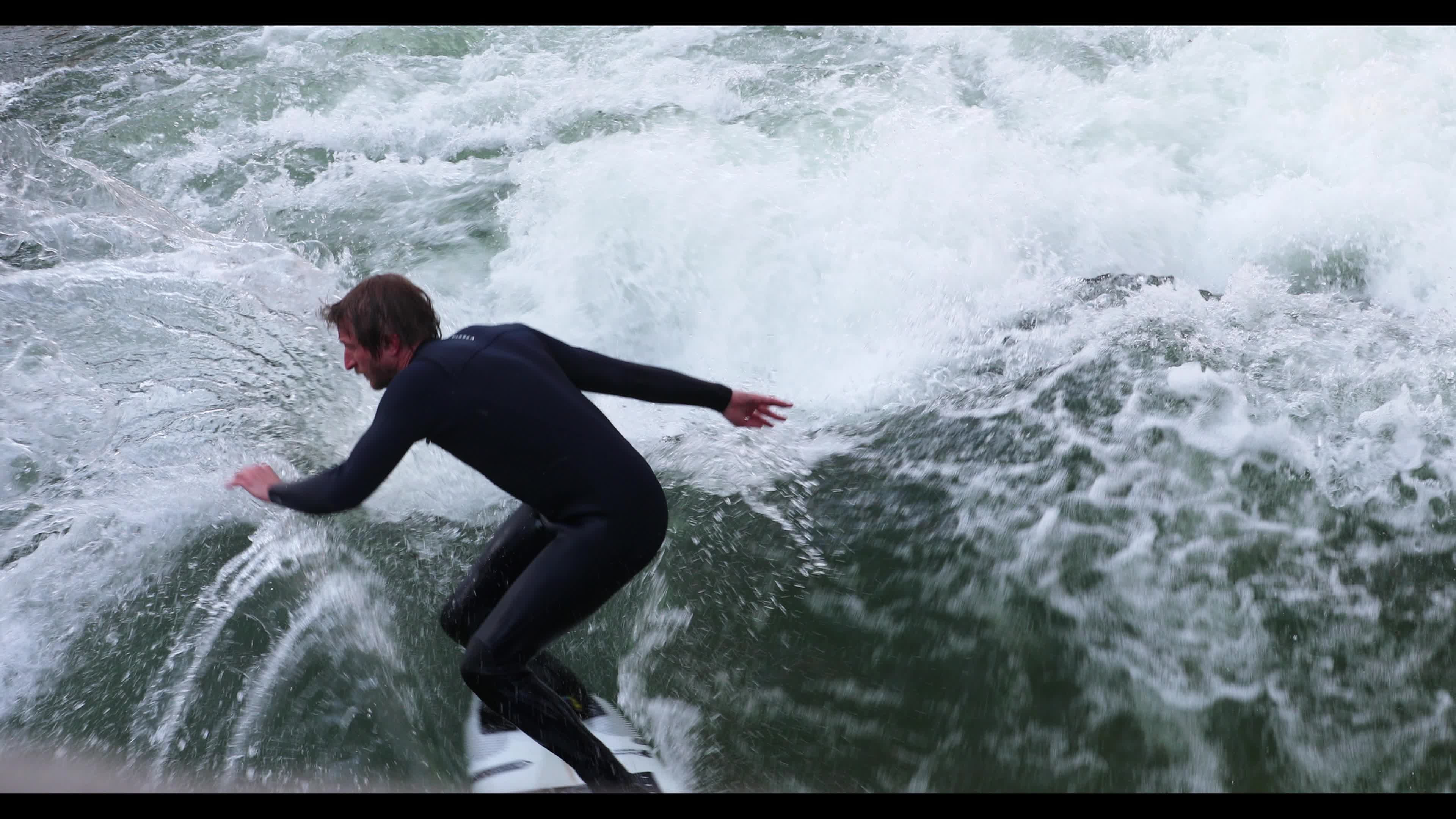Eisbach Surfers in Munich, Germany
