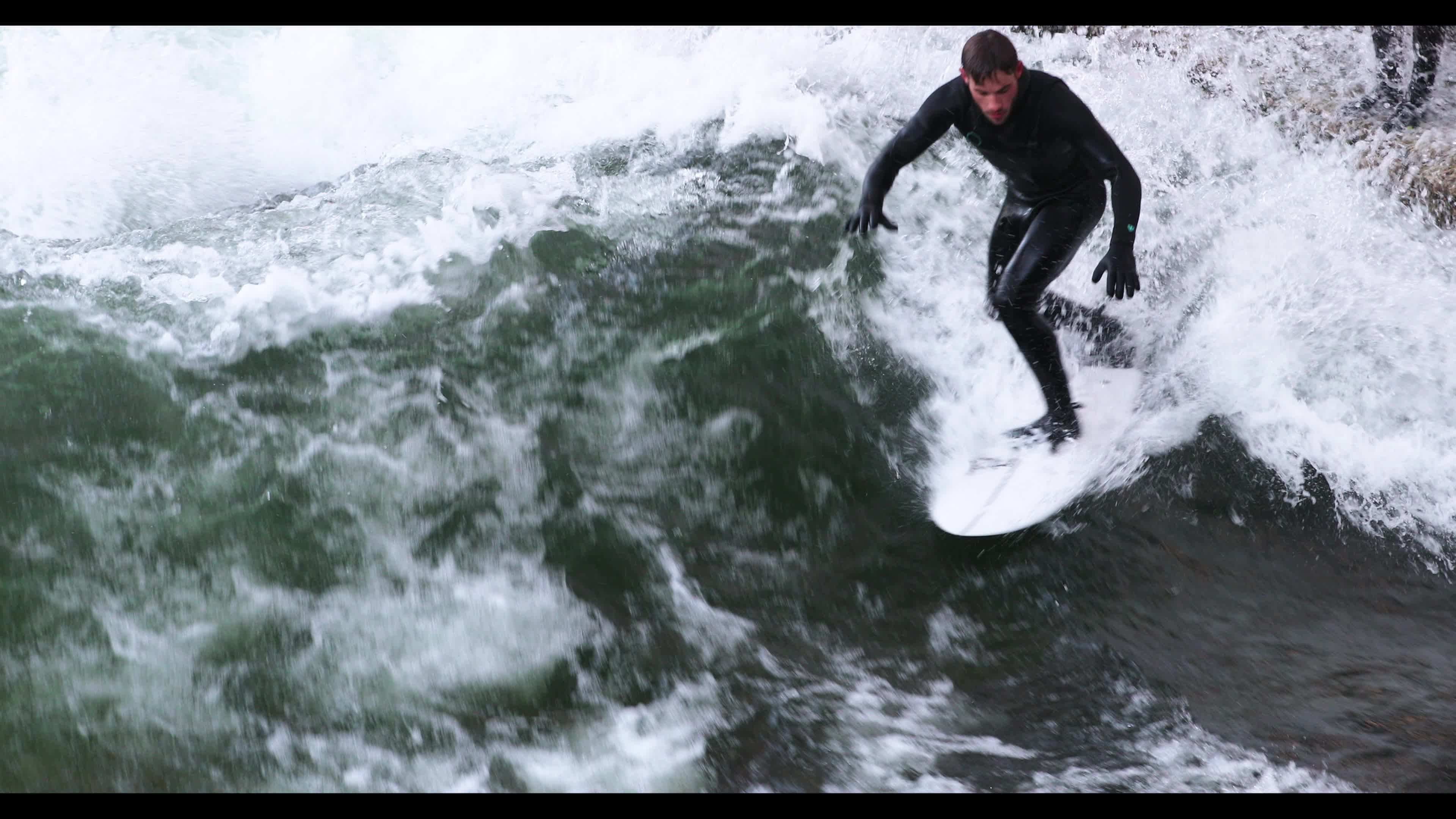 Eisbach Surfers in Munich, Germany