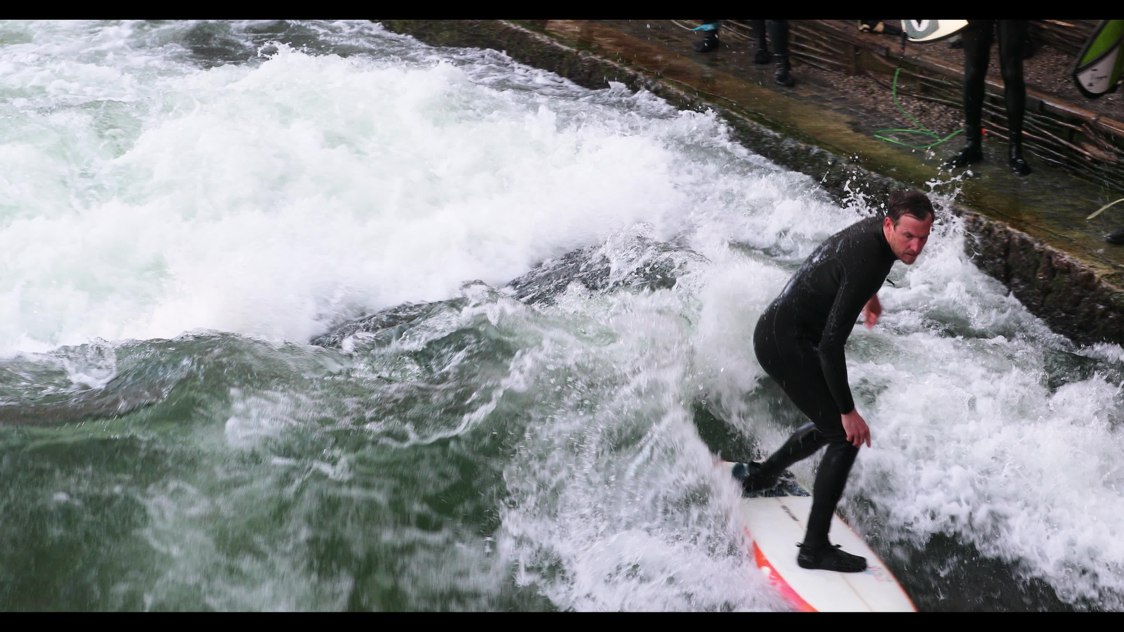 Eisbach Surfers in Munich, Germany