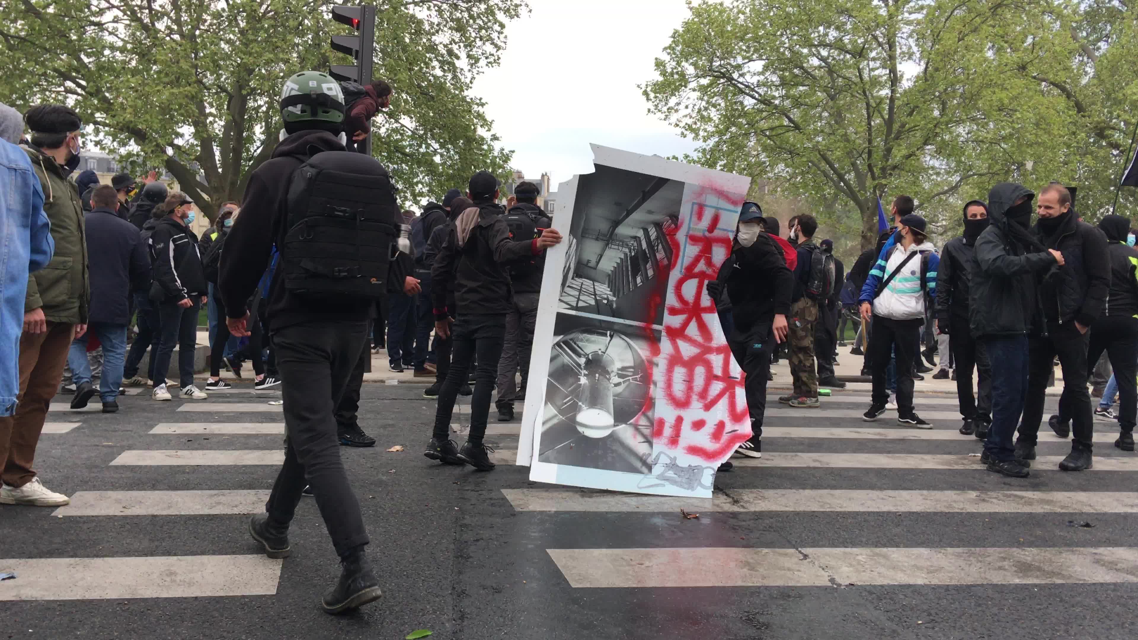 Protesters clash in Paris during the May Day