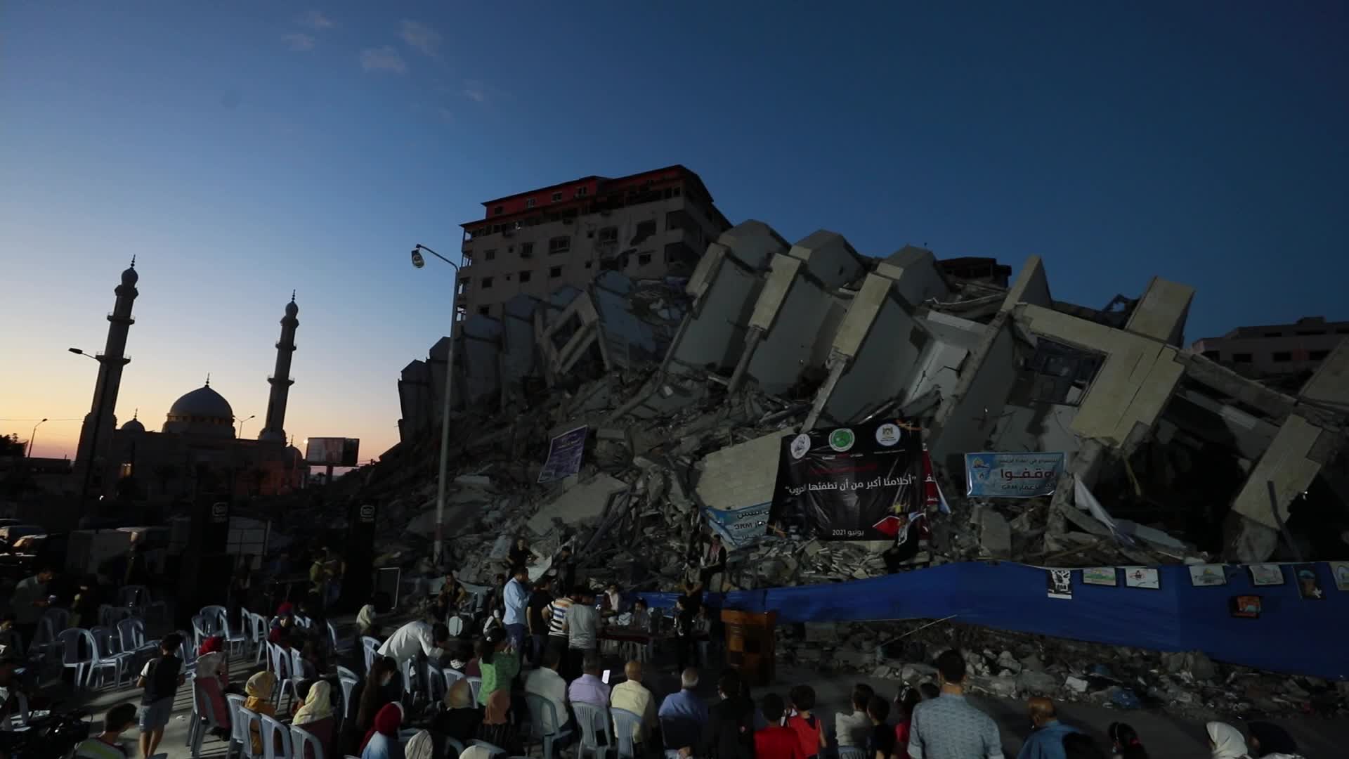 Singers perform on rubbles of a building in Gaza