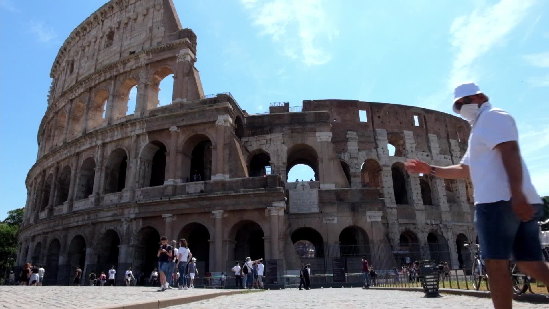 Tourists near the Colosseum in Rome, Italy