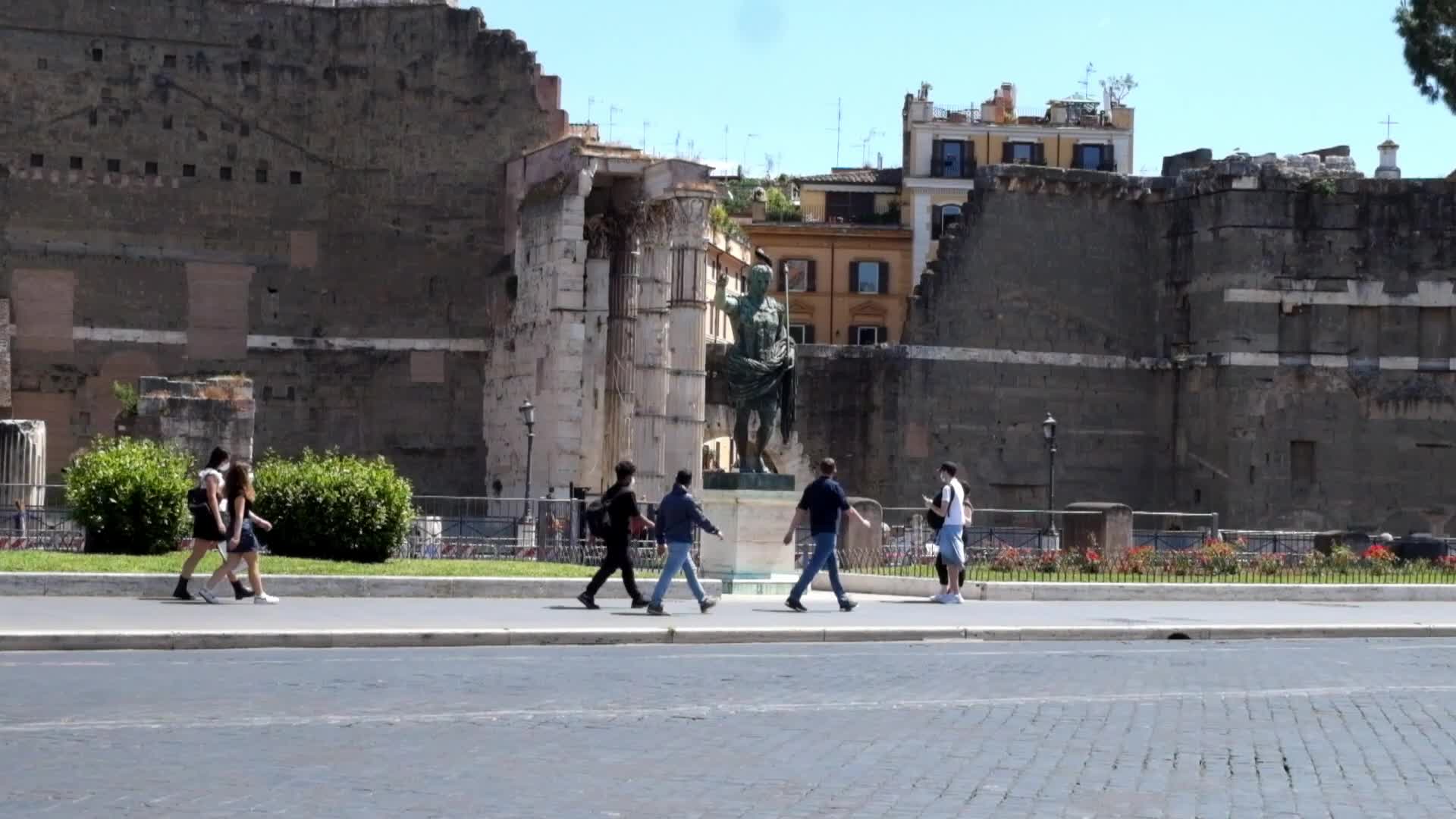 Tourists near the Colosseum in Rome, Italy