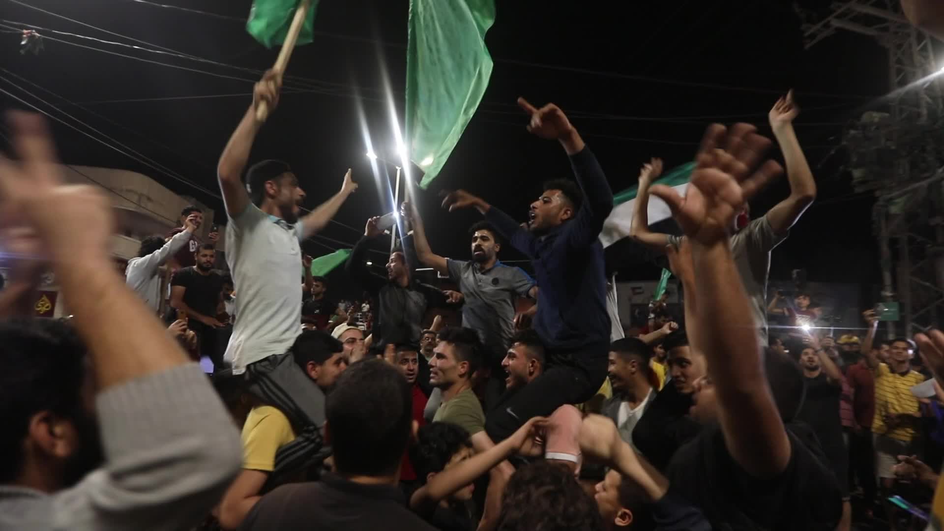 Palestinian celebrate the ceasefire with Israel