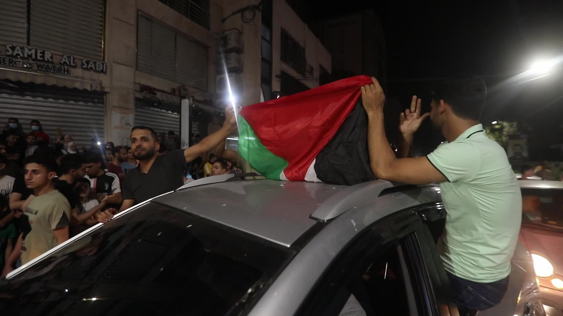 Palestinian celebrate the ceasefire with Israel