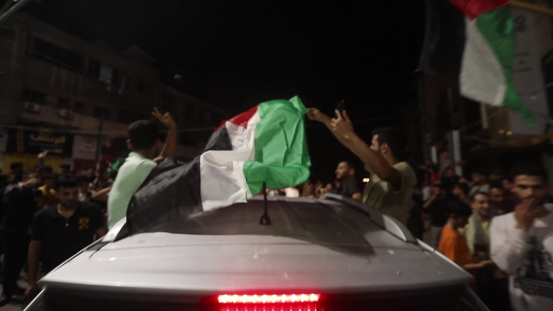 Palestinian celebrate the ceasefire with Israel