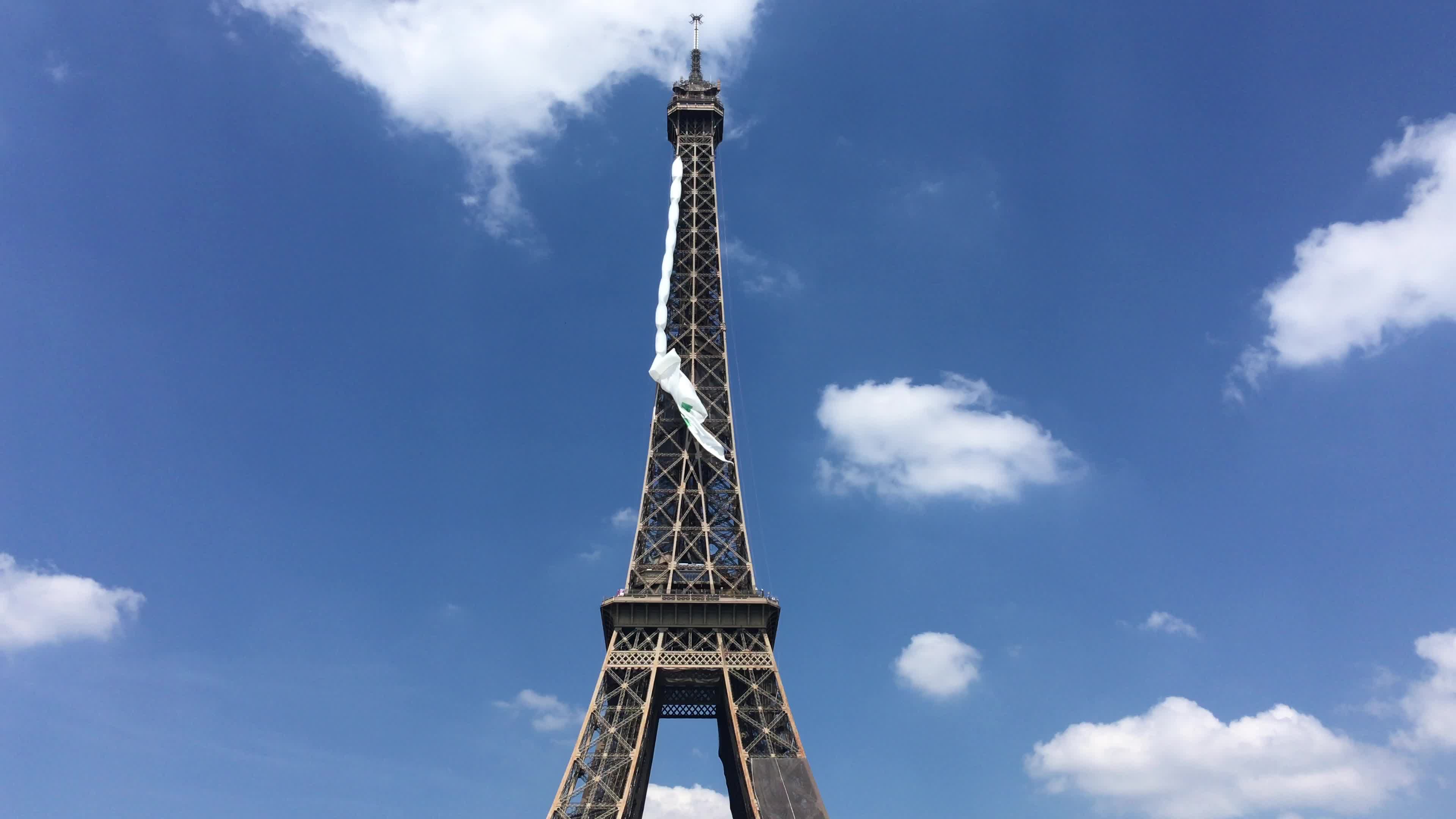  A giant flag at the top of the Eiffel Tower 