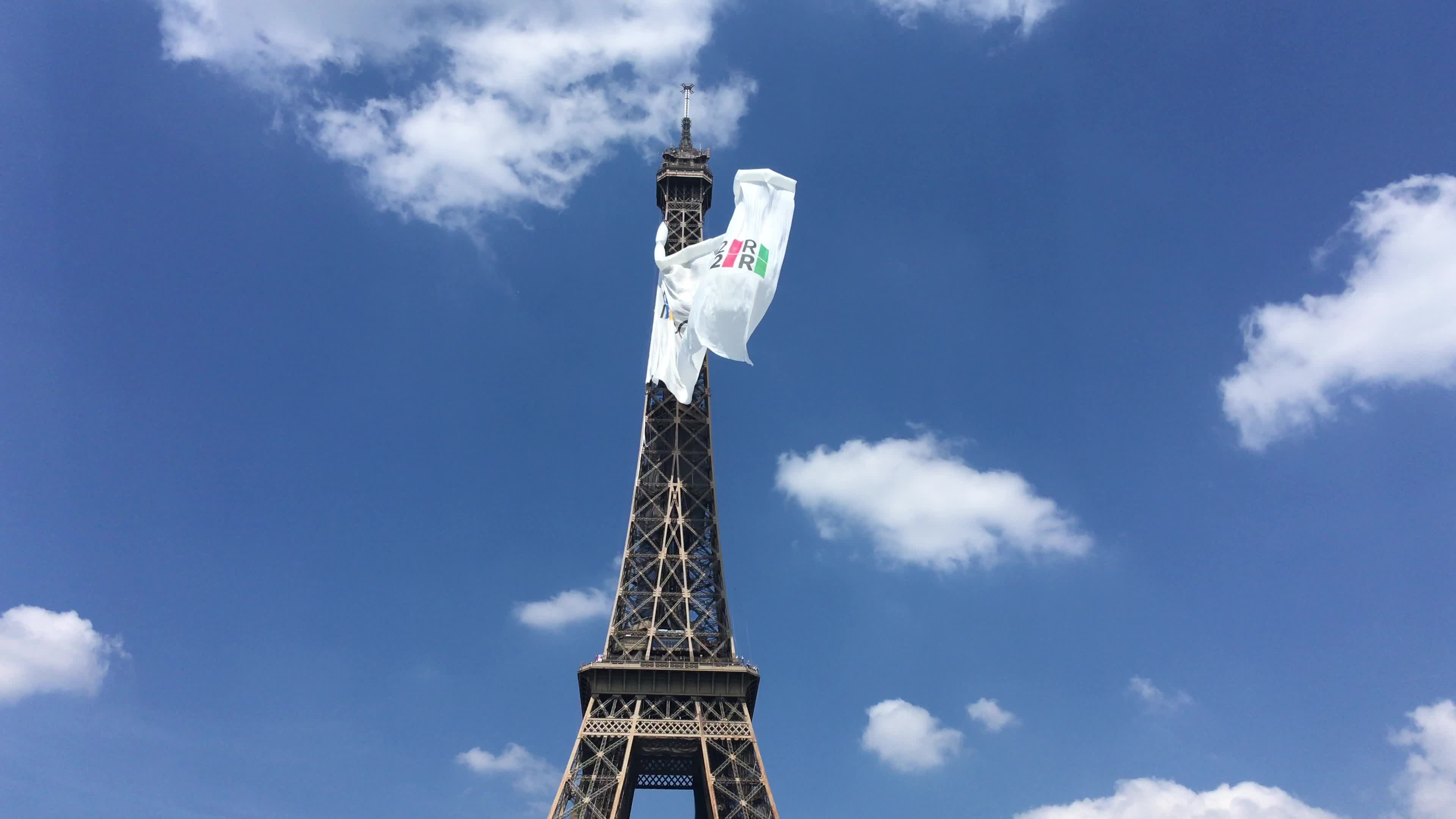  A giant flag at the top of the Eiffel Tower 