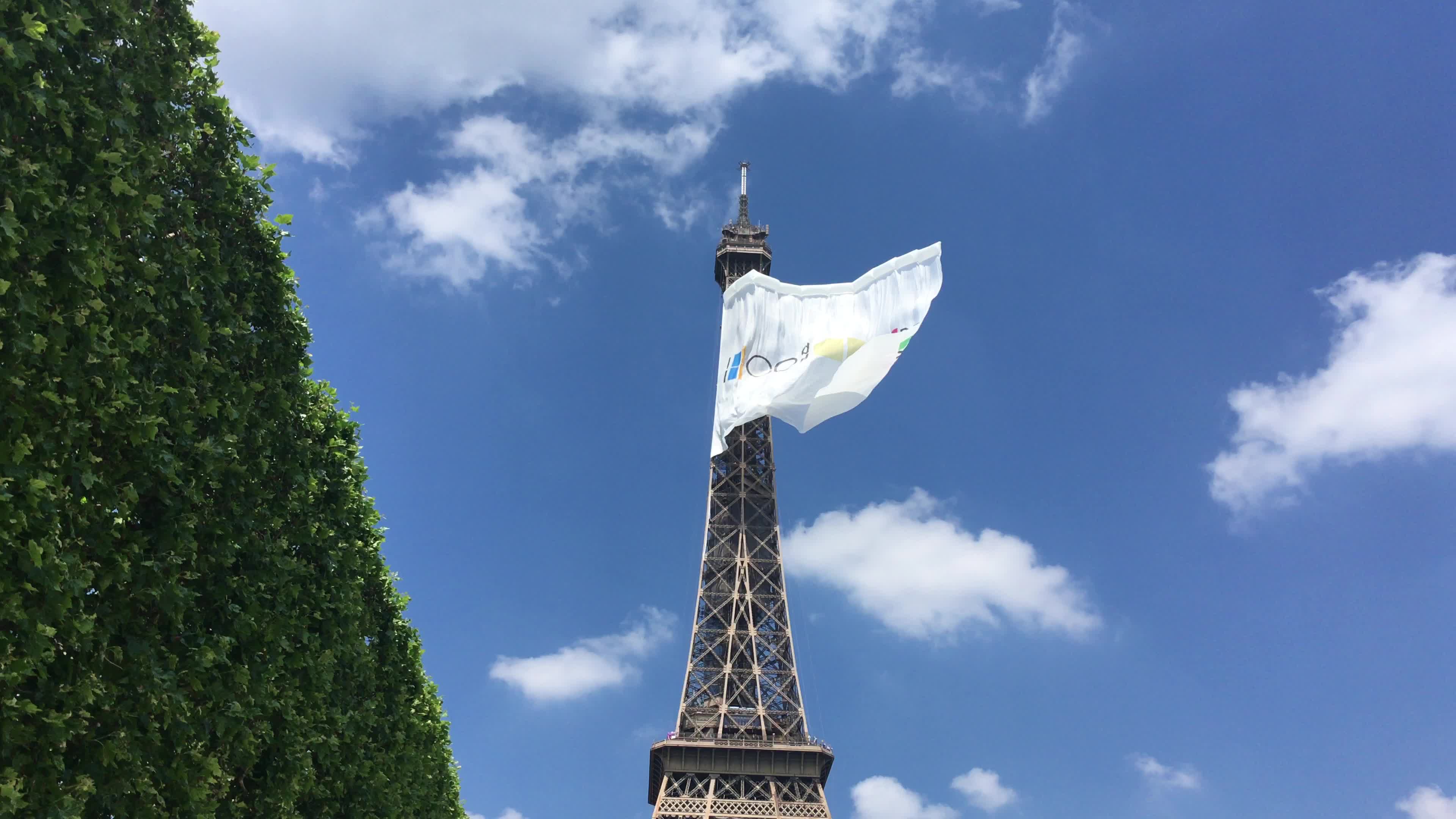  A giant flag at the top of the Eiffel Tower 