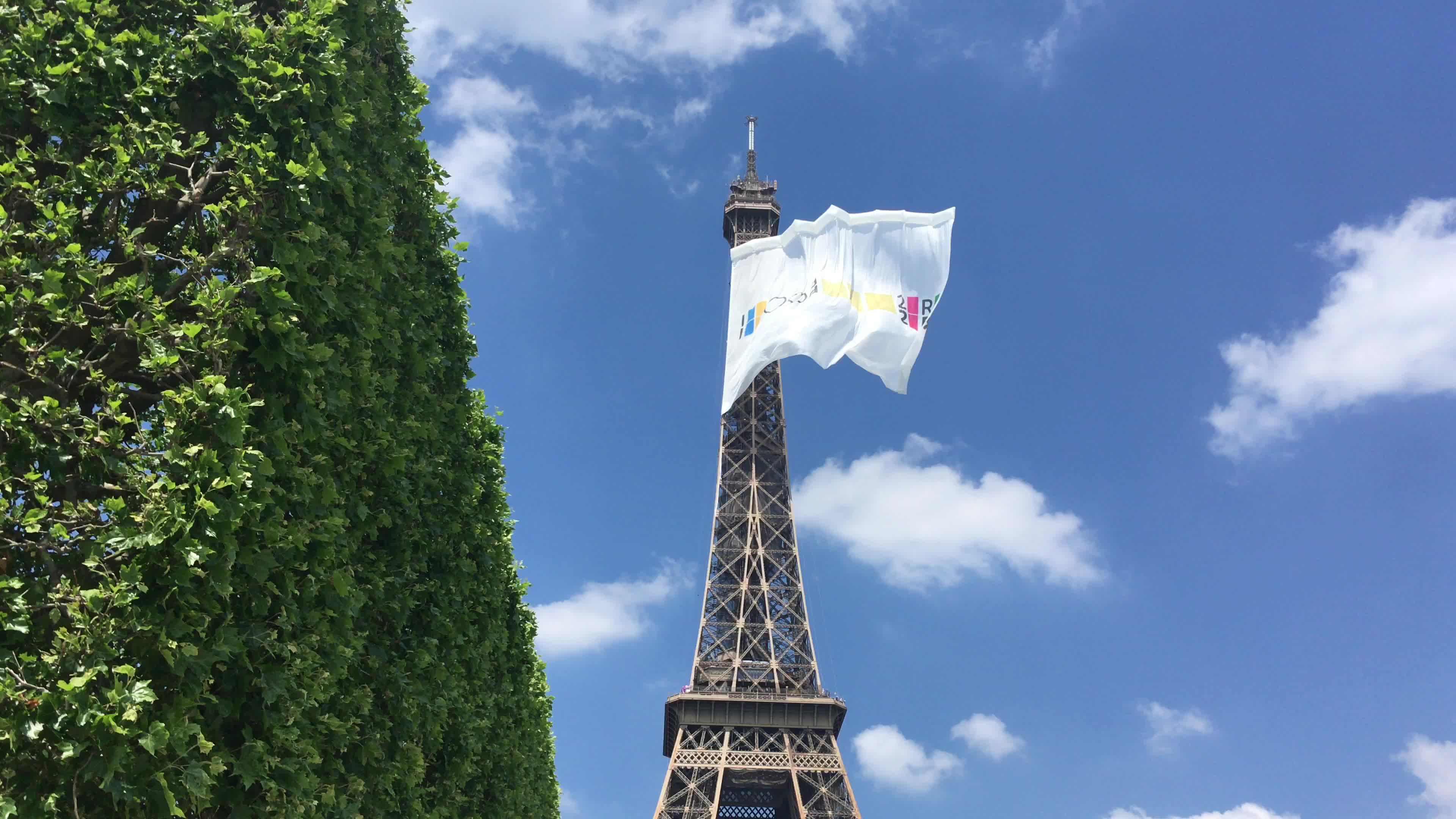  A giant flag at the top of the Eiffel Tower 