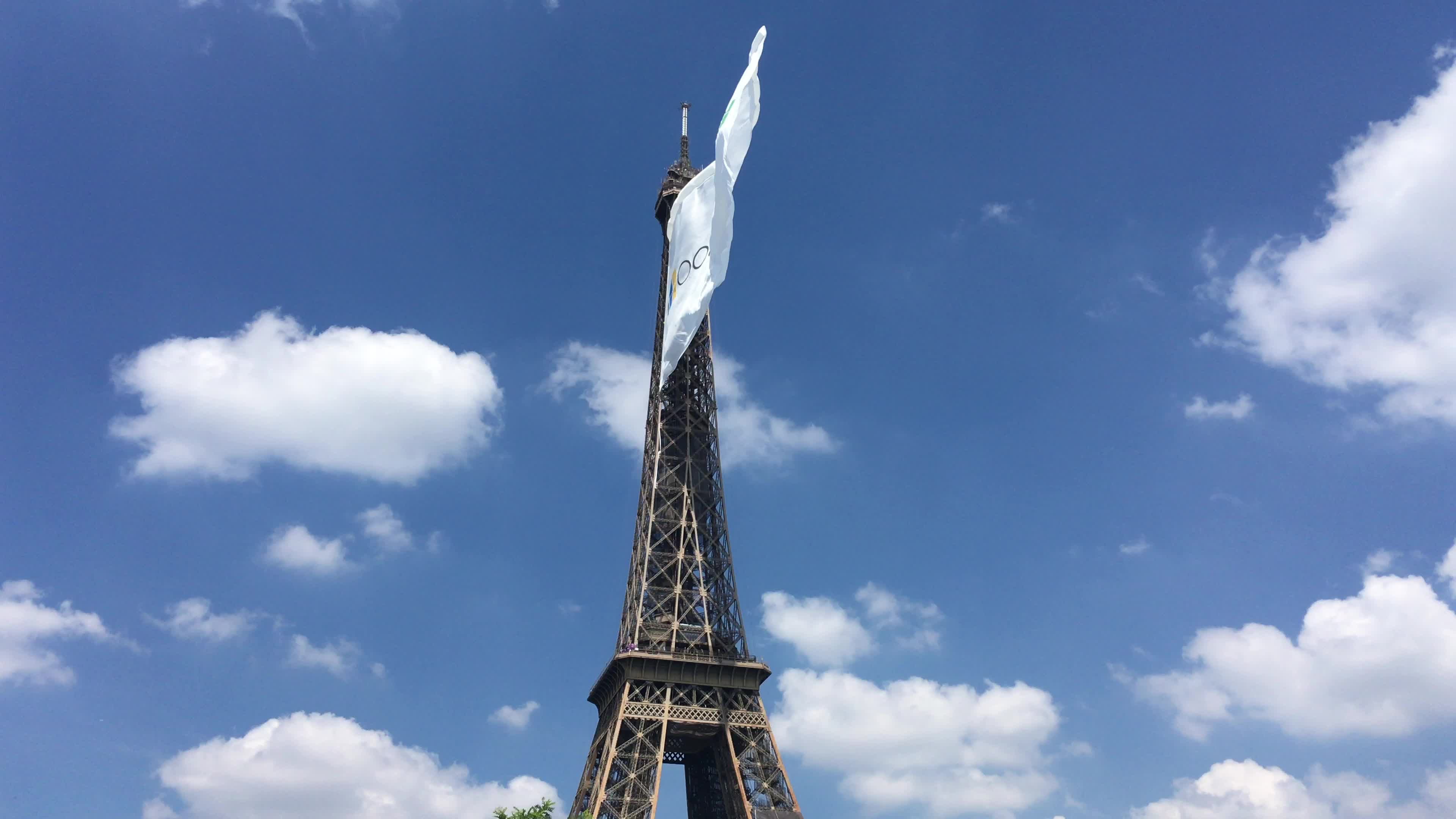  A giant flag at the top of the Eiffel Tower 