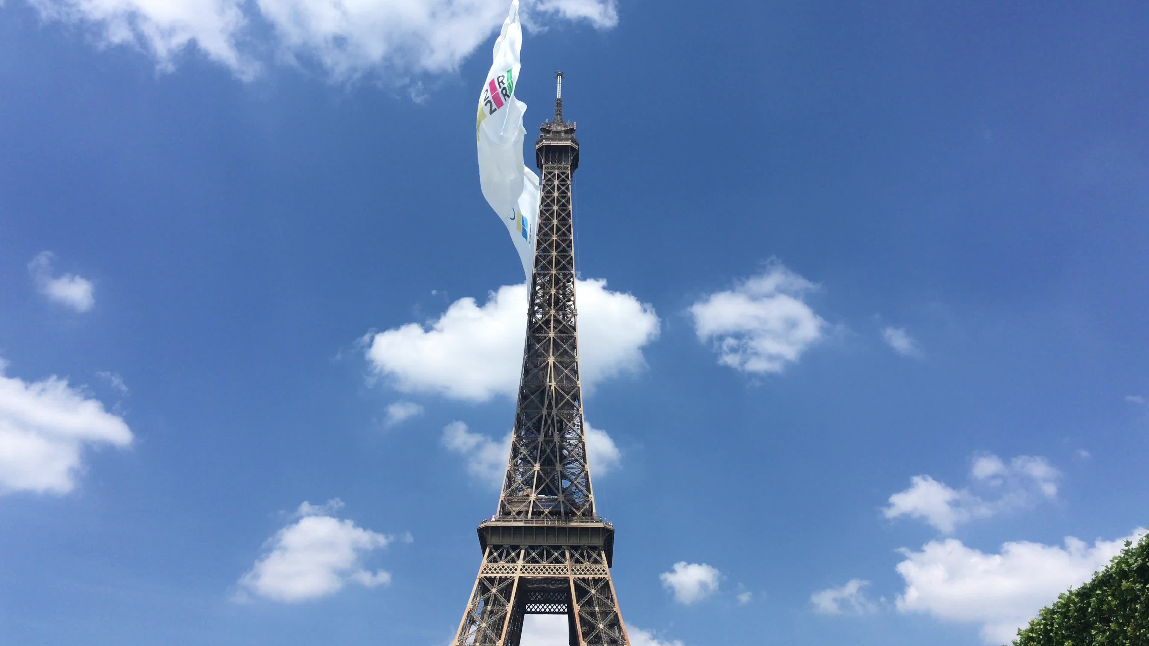  A giant flag at the top of the Eiffel Tower 