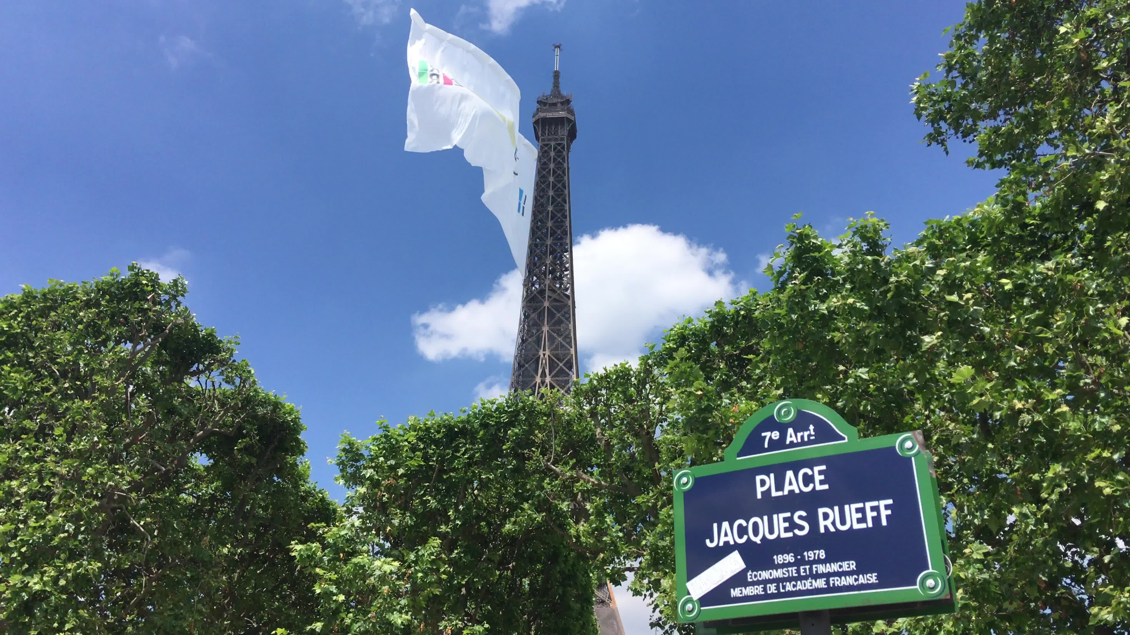  A giant flag at the top of the Eiffel Tower 