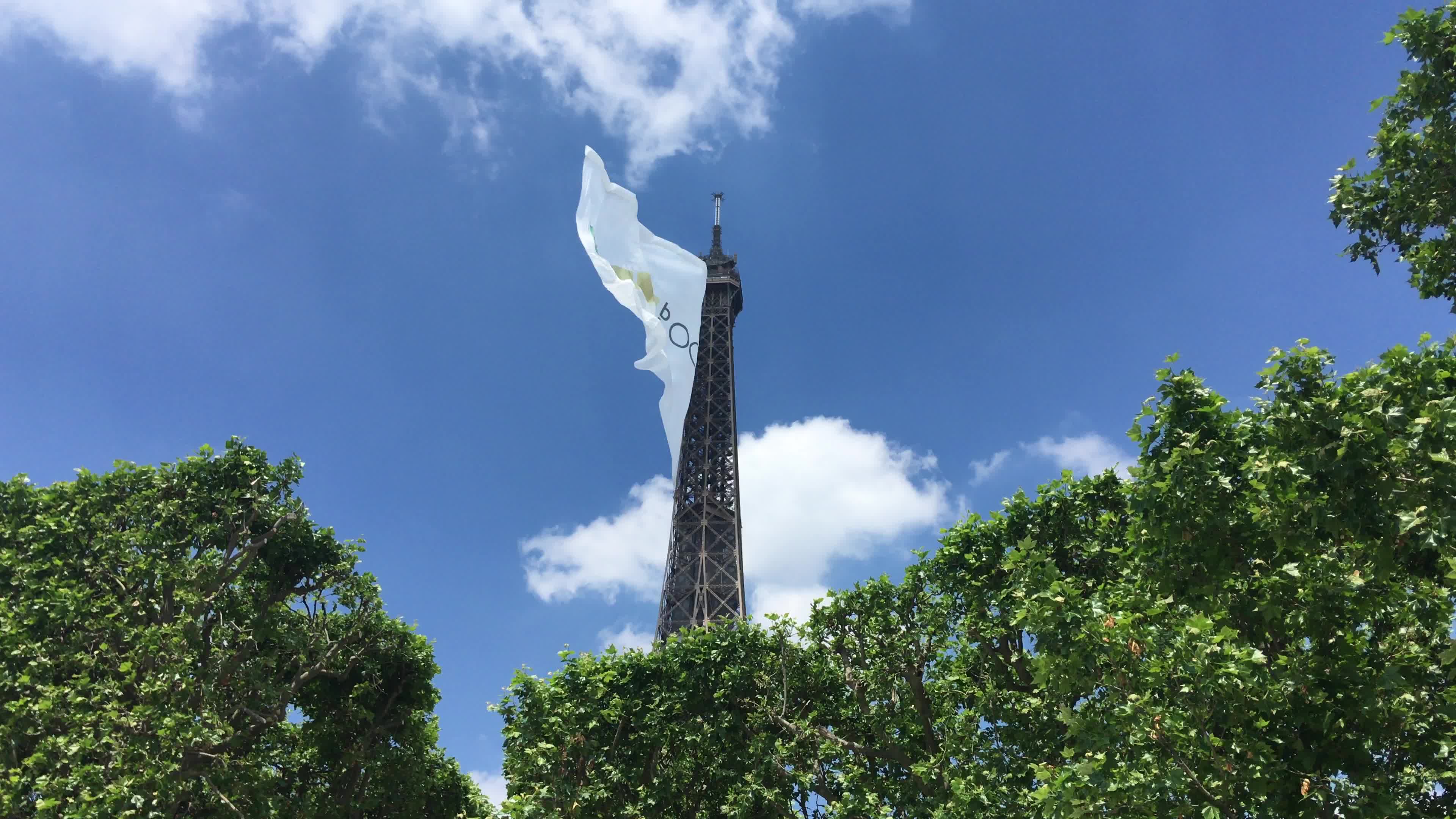  A giant flag at the top of the Eiffel Tower 