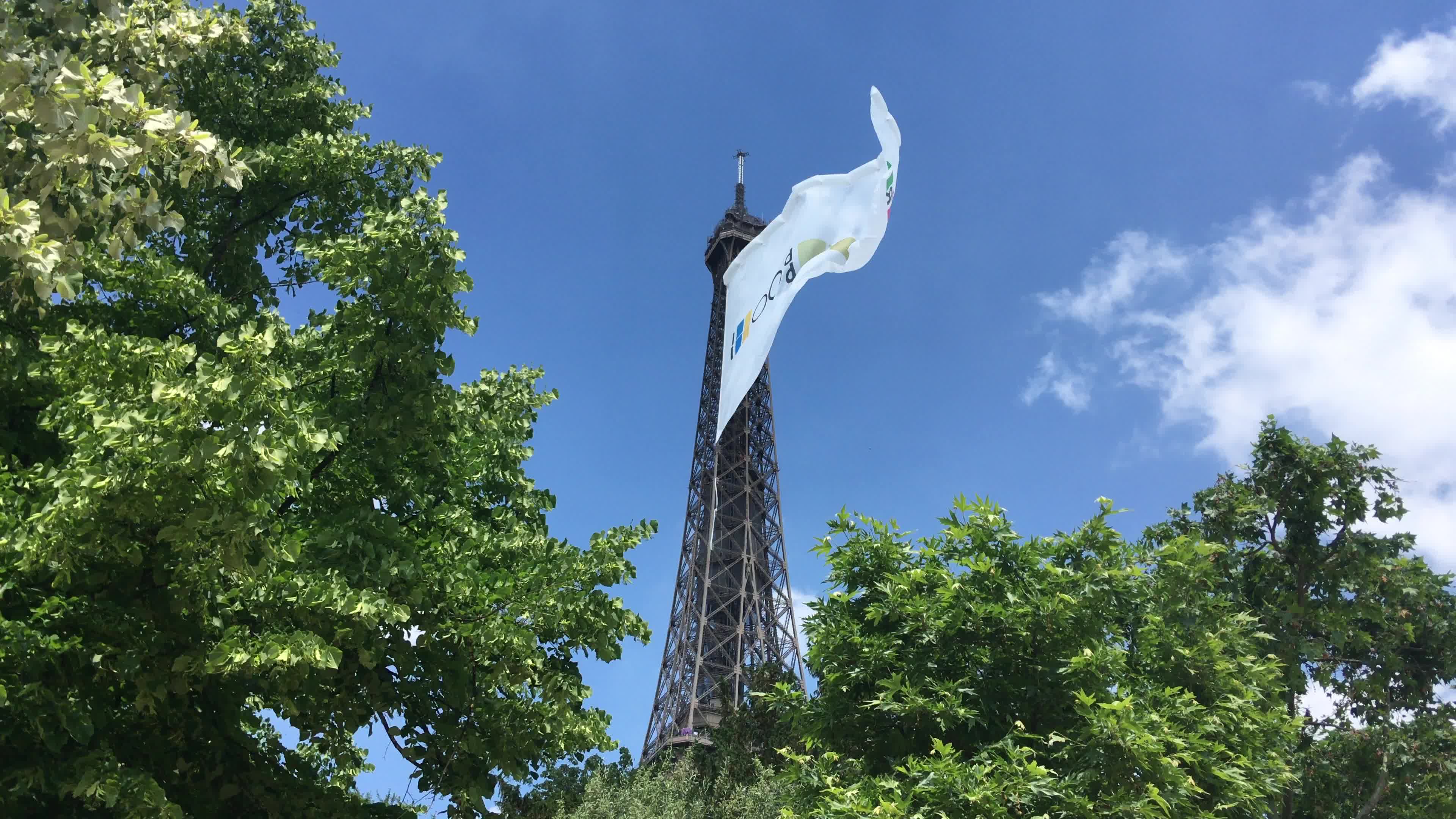  A giant flag at the top of the Eiffel Tower 