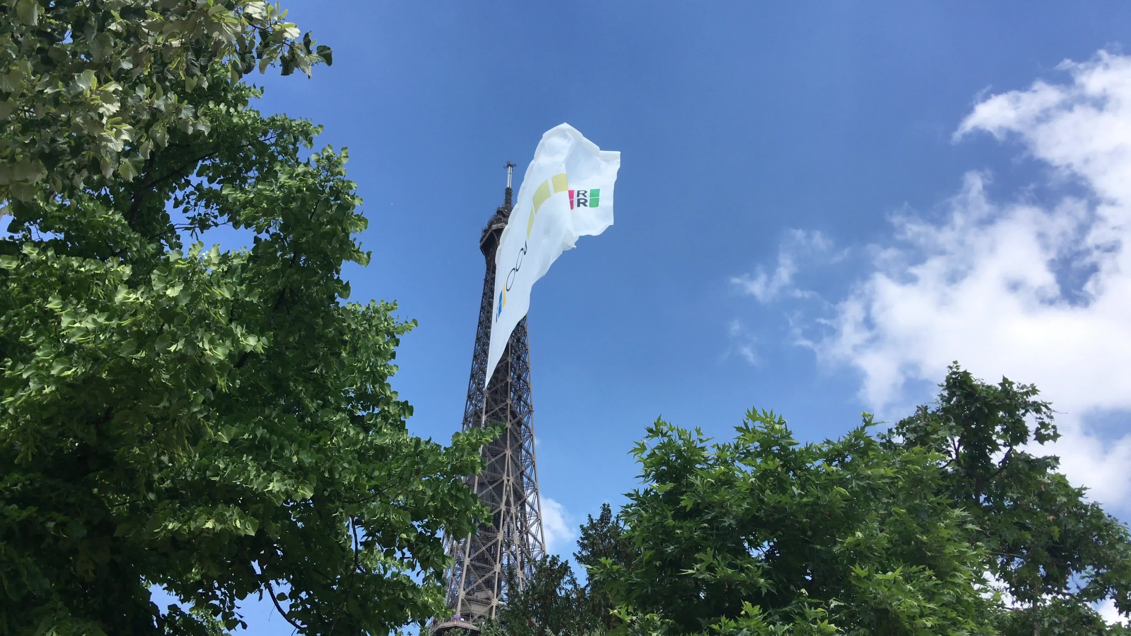  A giant flag at the top of the Eiffel Tower 