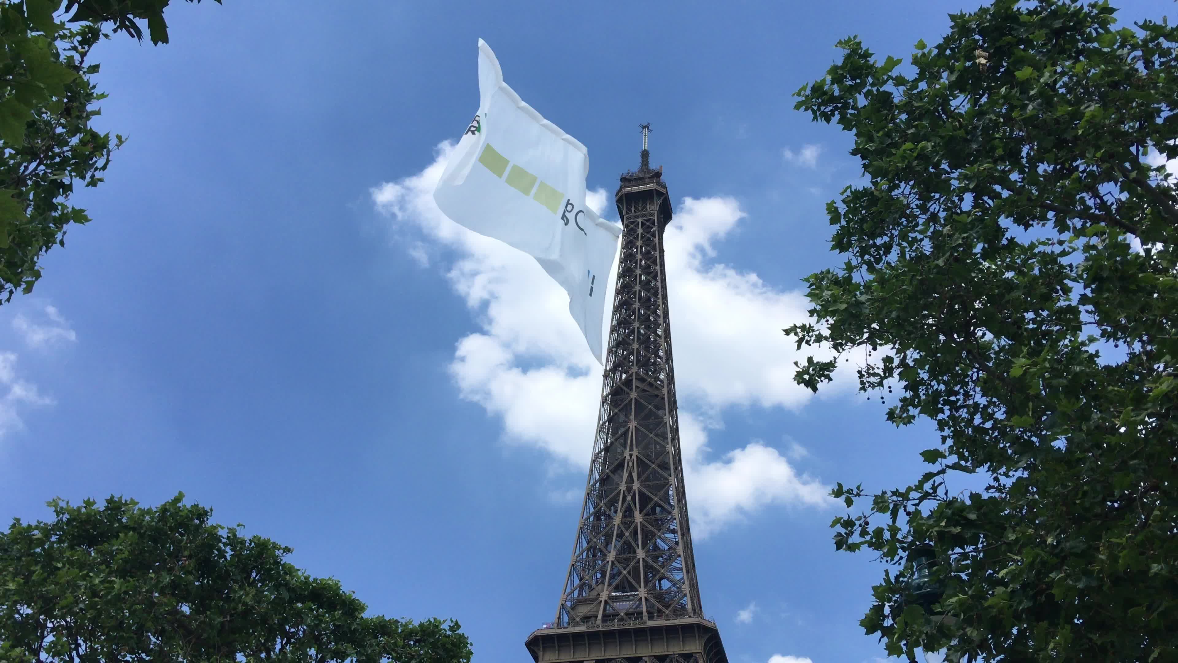  A giant flag at the top of the Eiffel Tower 