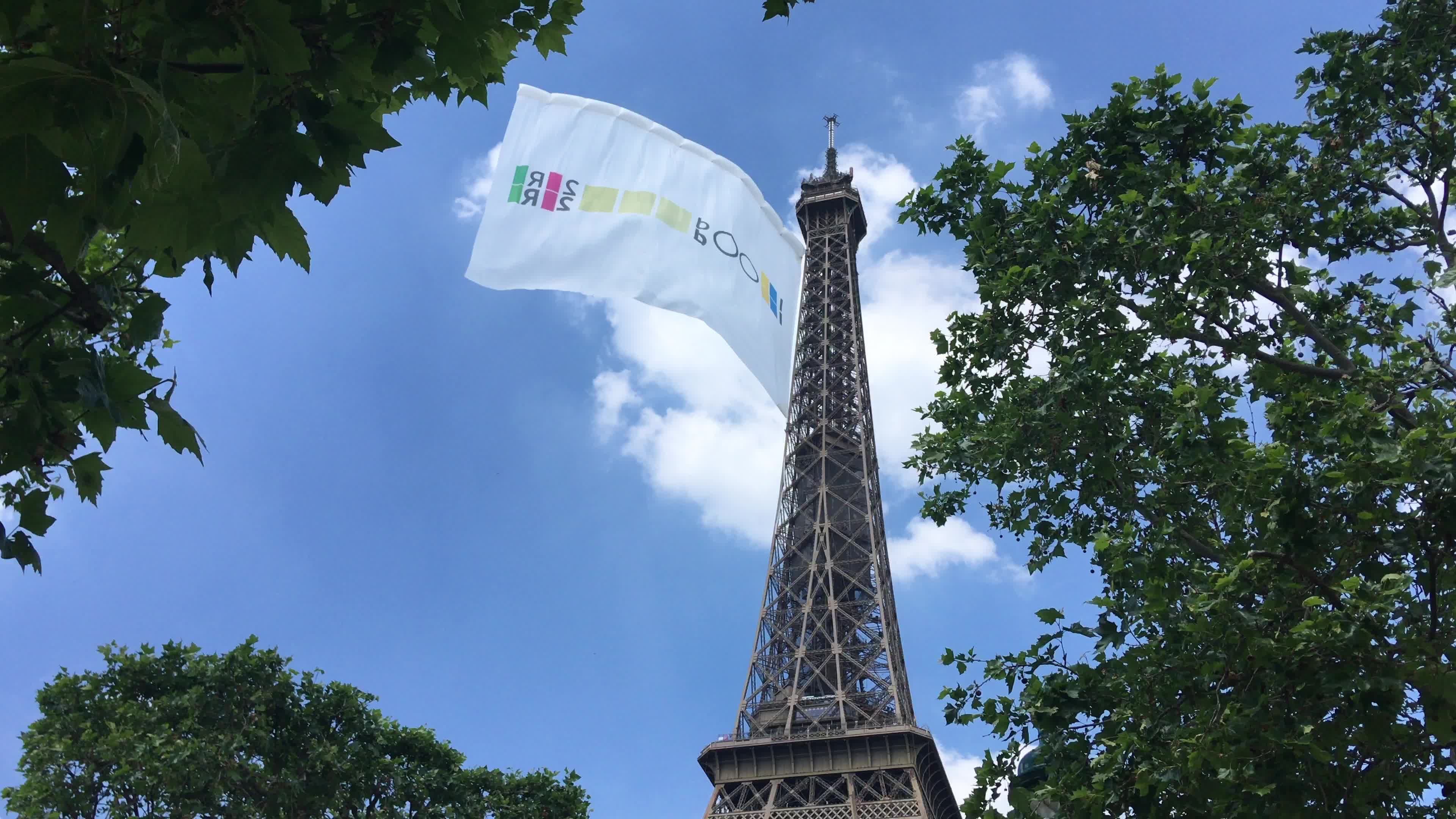  A giant flag at the top of the Eiffel Tower 