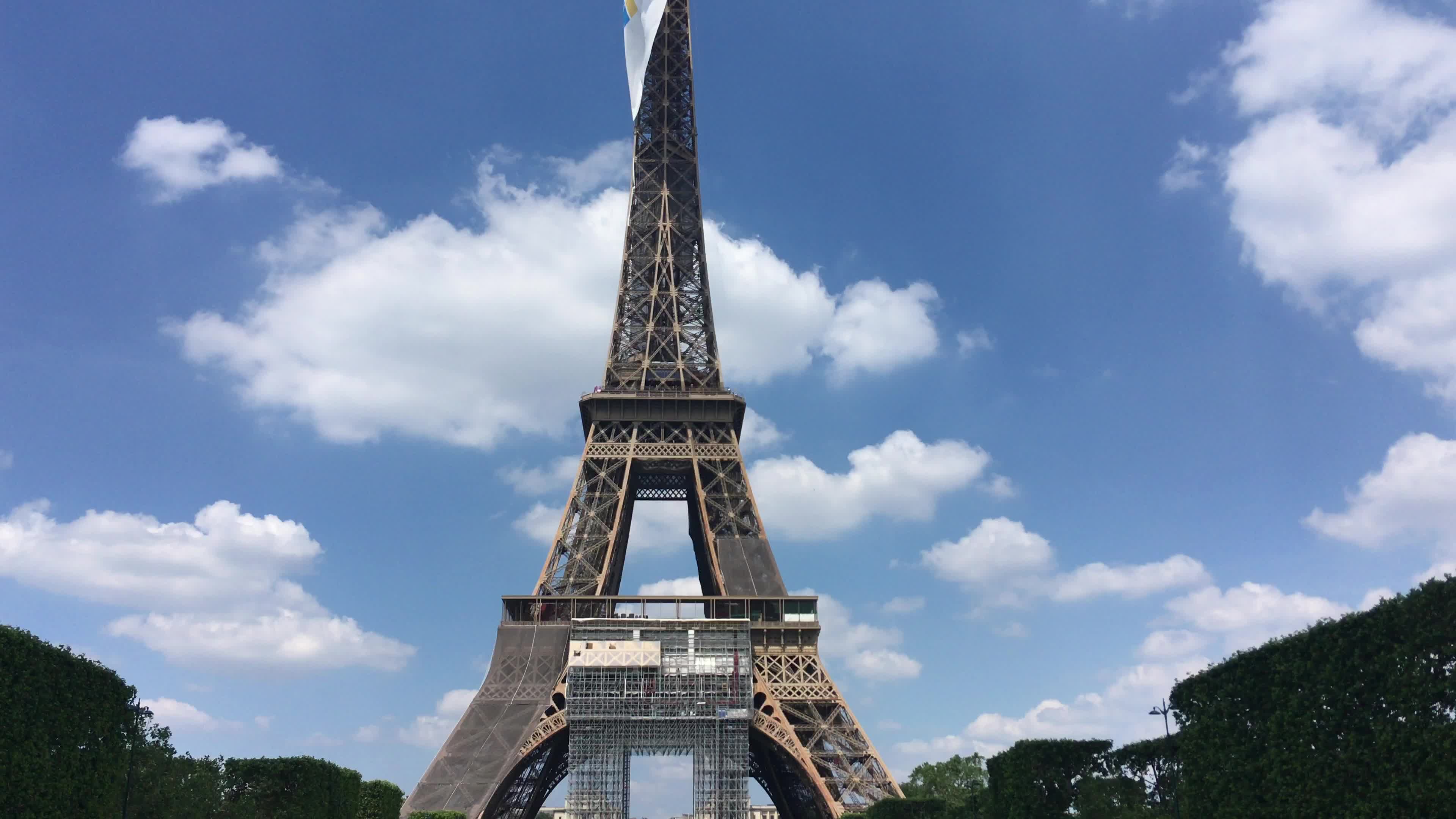  A giant flag at the top of the Eiffel Tower 