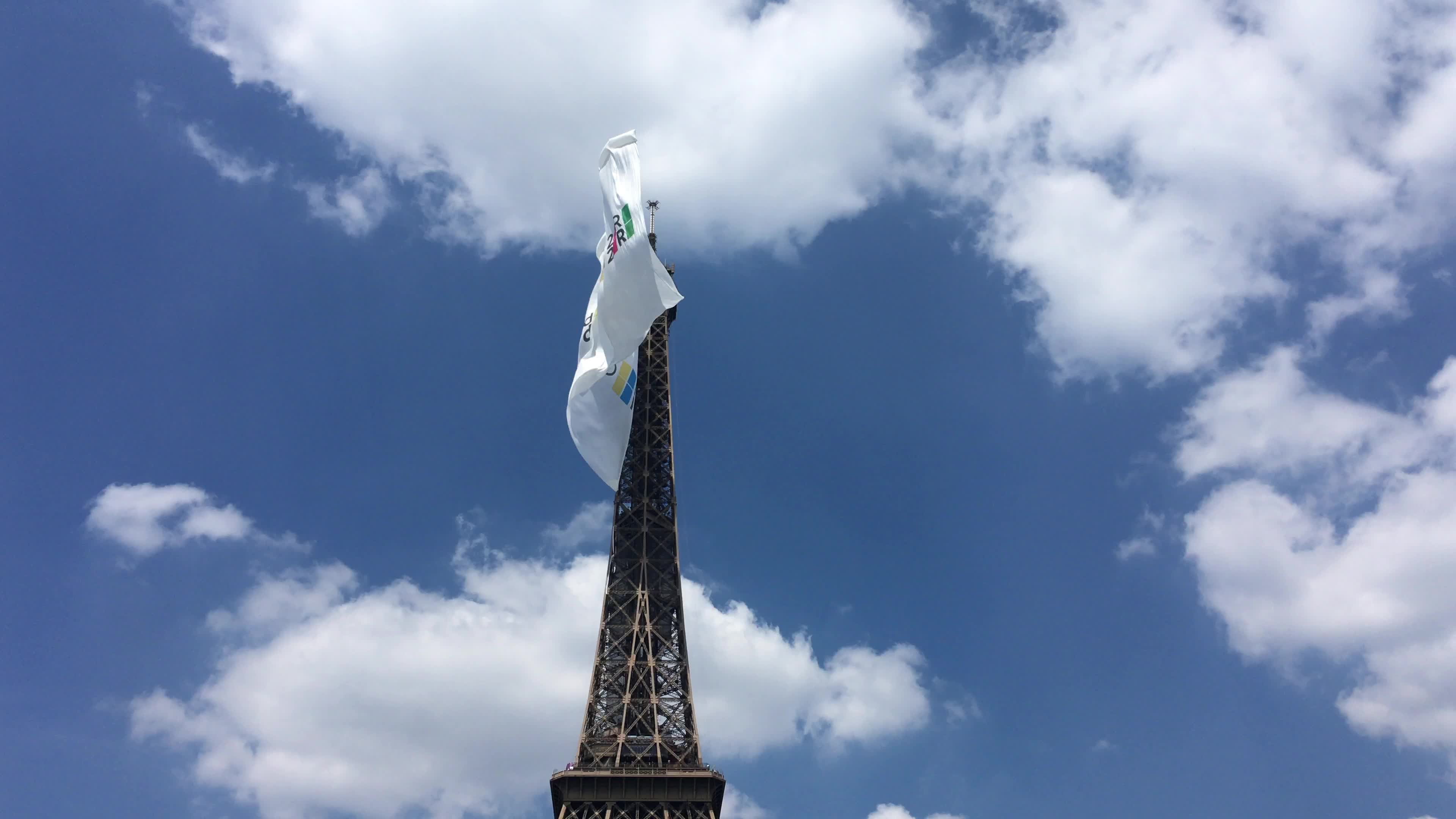  A giant flag at the top of the Eiffel Tower 