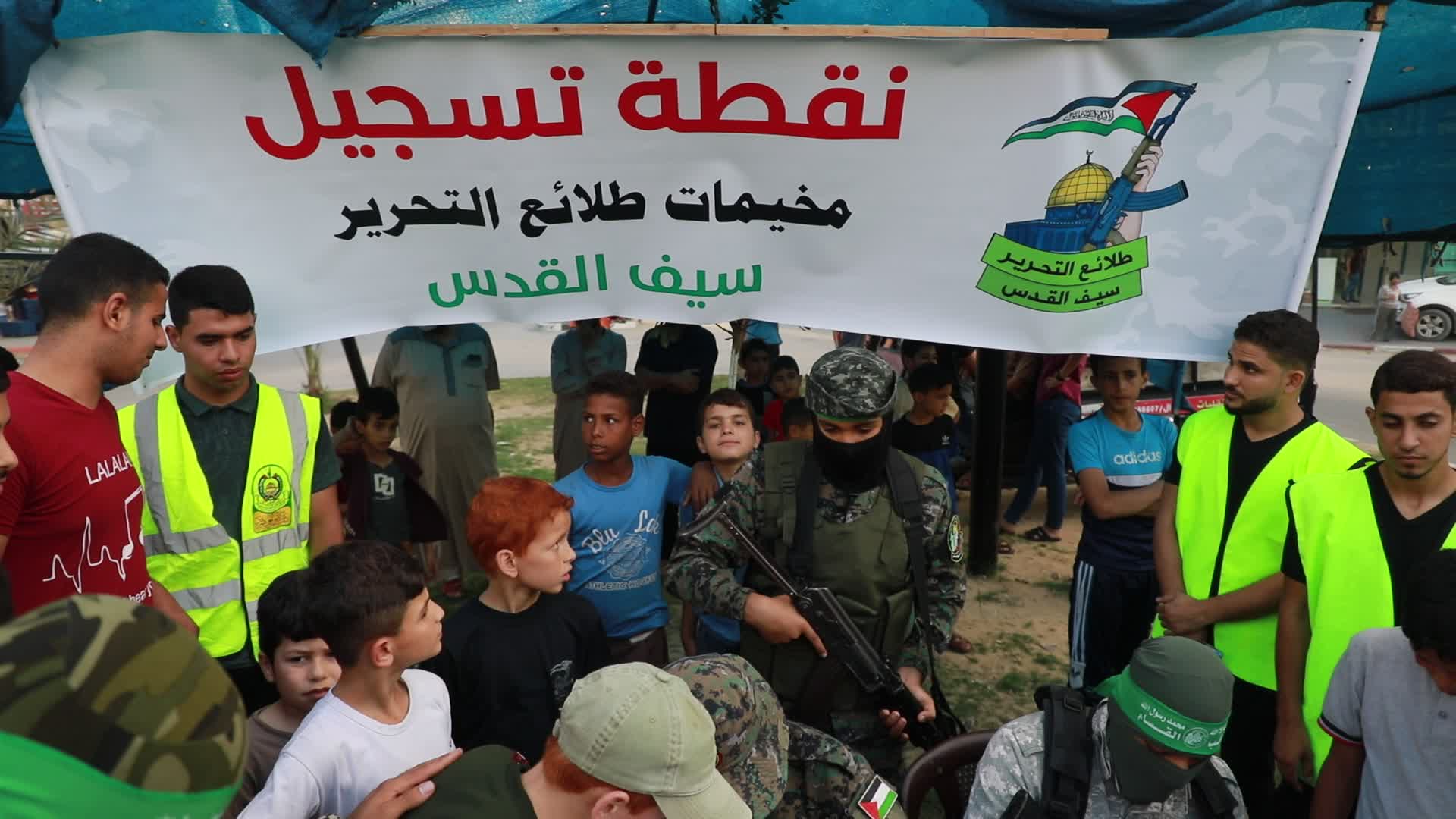Palestinians registers to a summer camp organized by brigades in Gaza