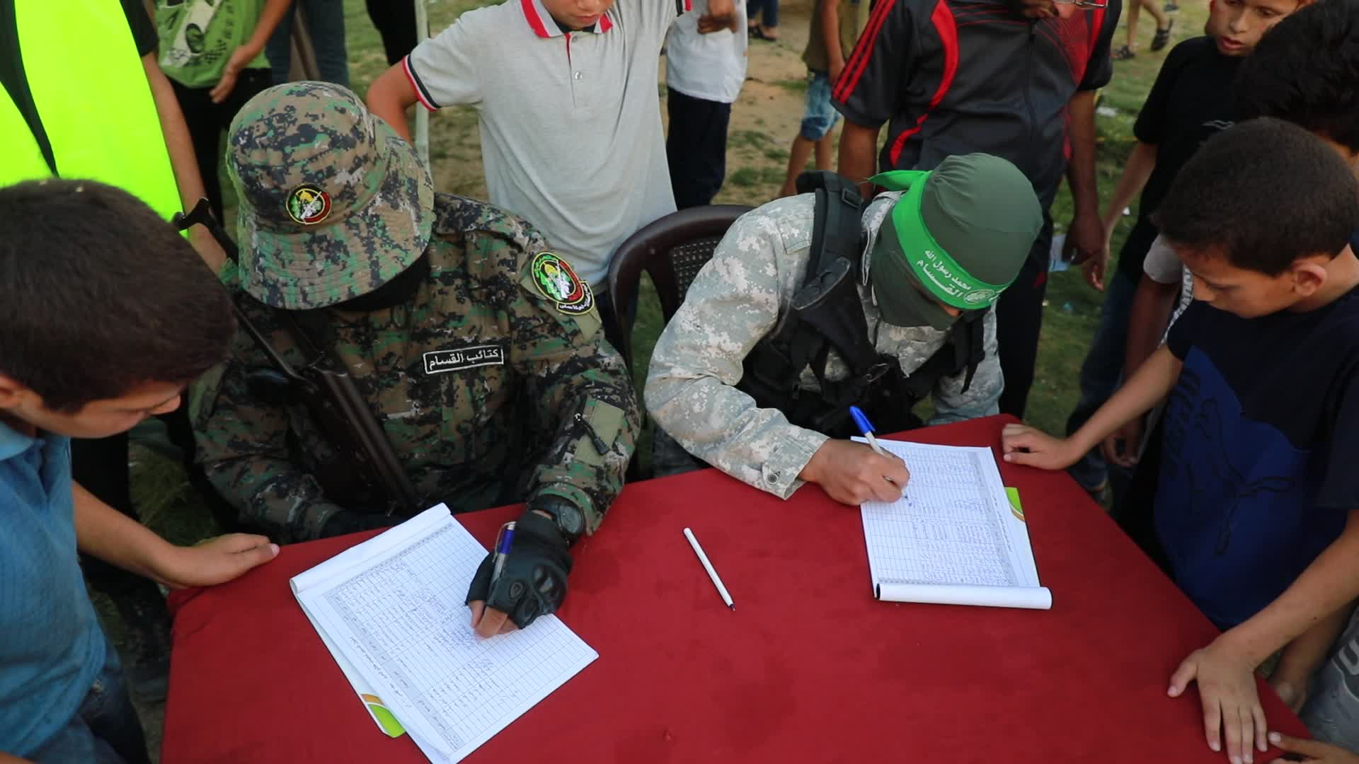 Palestinians registers to a summer camp organized by brigades in Gaza