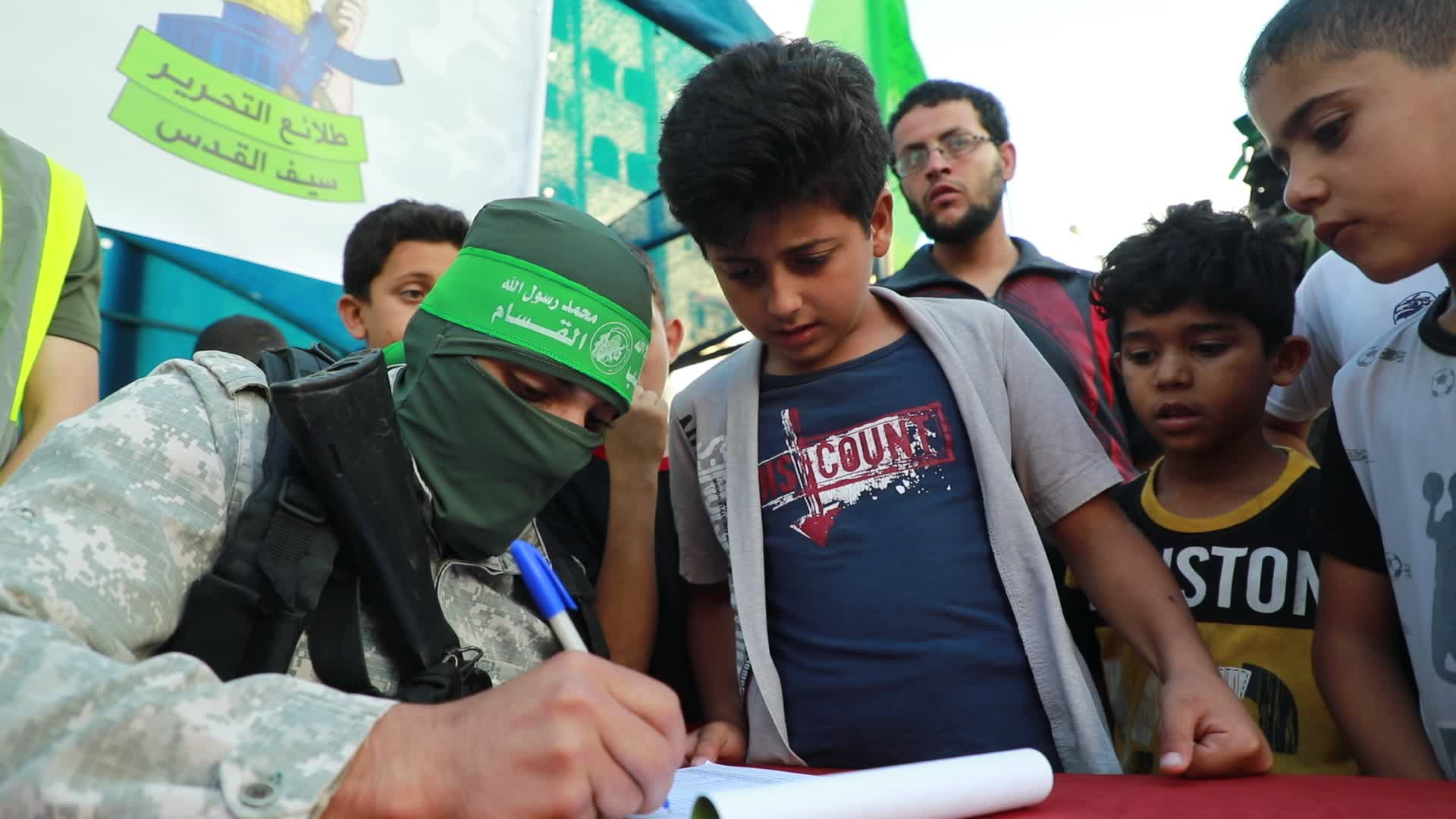 Palestinians registers to a summer camp organized by brigades in Gaza