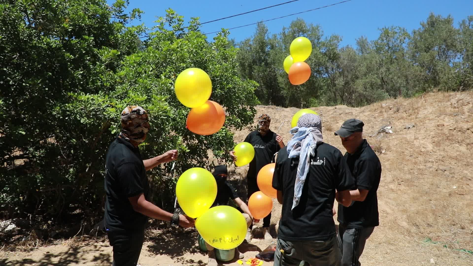 Preparation of incendiary balloons in Gaza