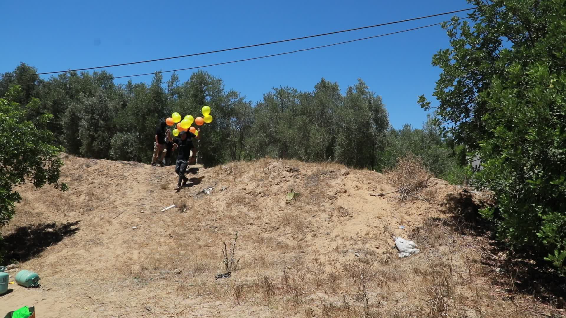 Preparation of incendiary balloons in Gaza