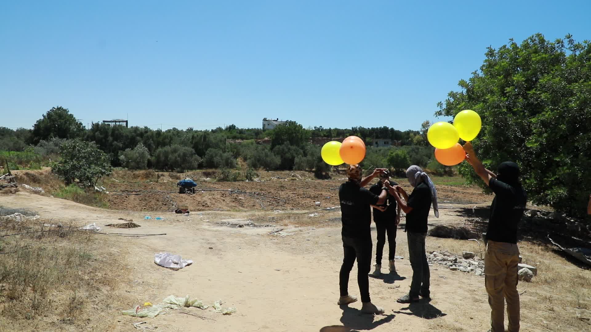 Preparation of incendiary balloons in Gaza