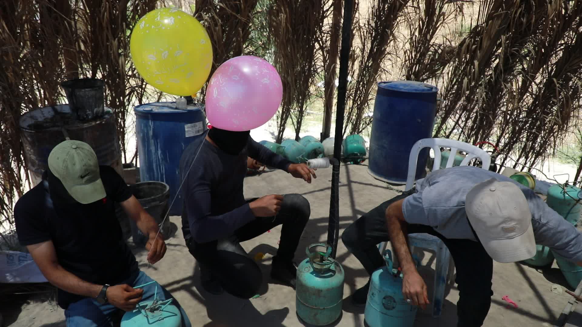 Preparation of incendiary balloons in Gaza