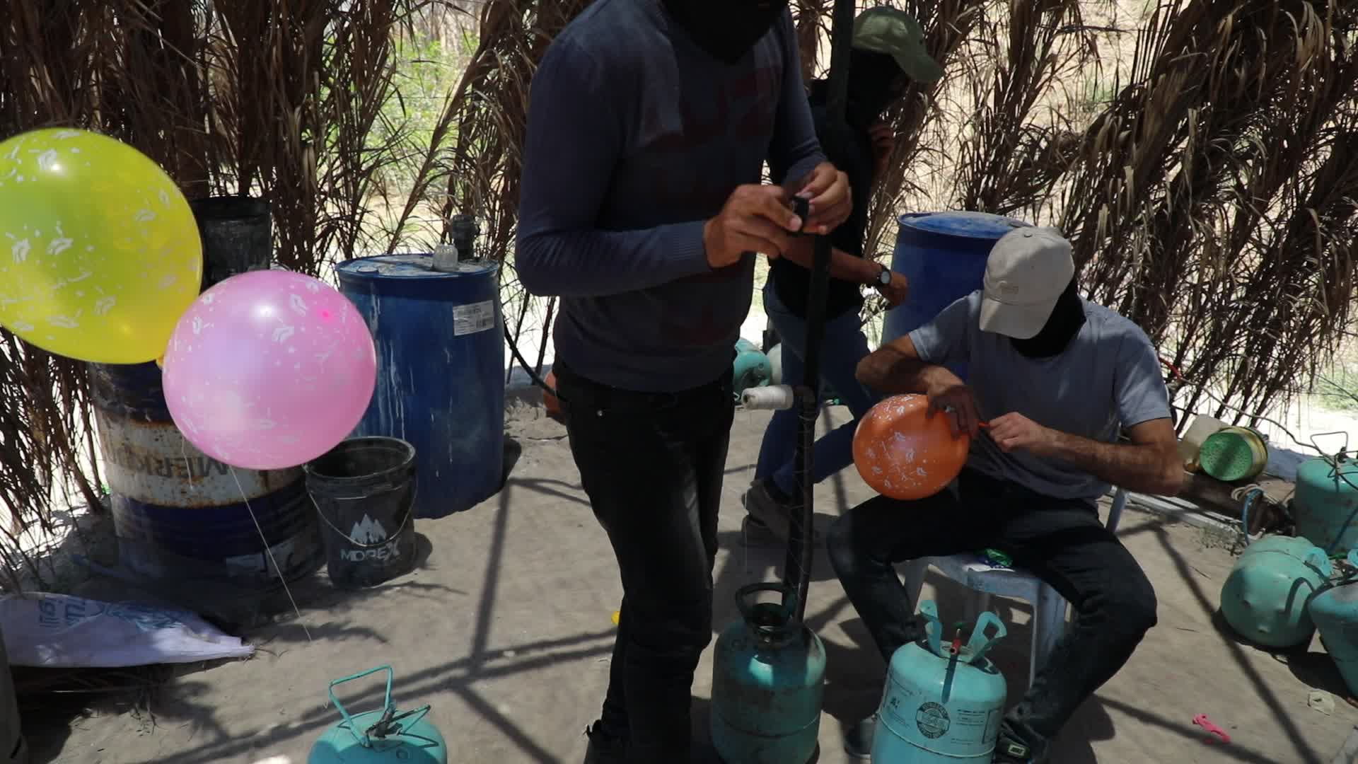 Preparation of incendiary balloons in Gaza