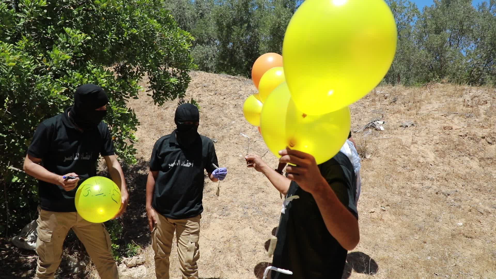 Preparation of incendiary balloons in Gaza