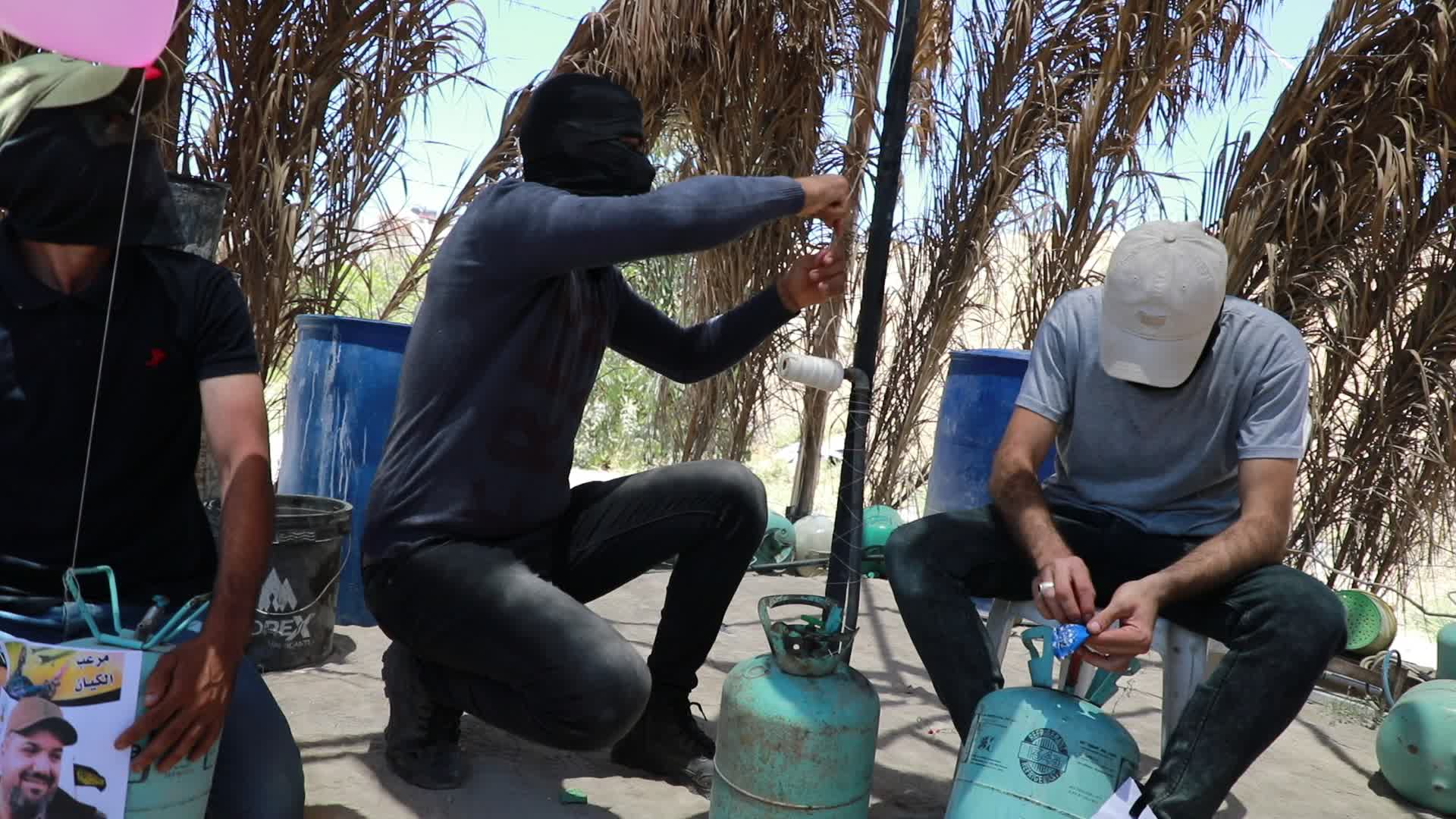 Preparation of incendiary balloons in Gaza