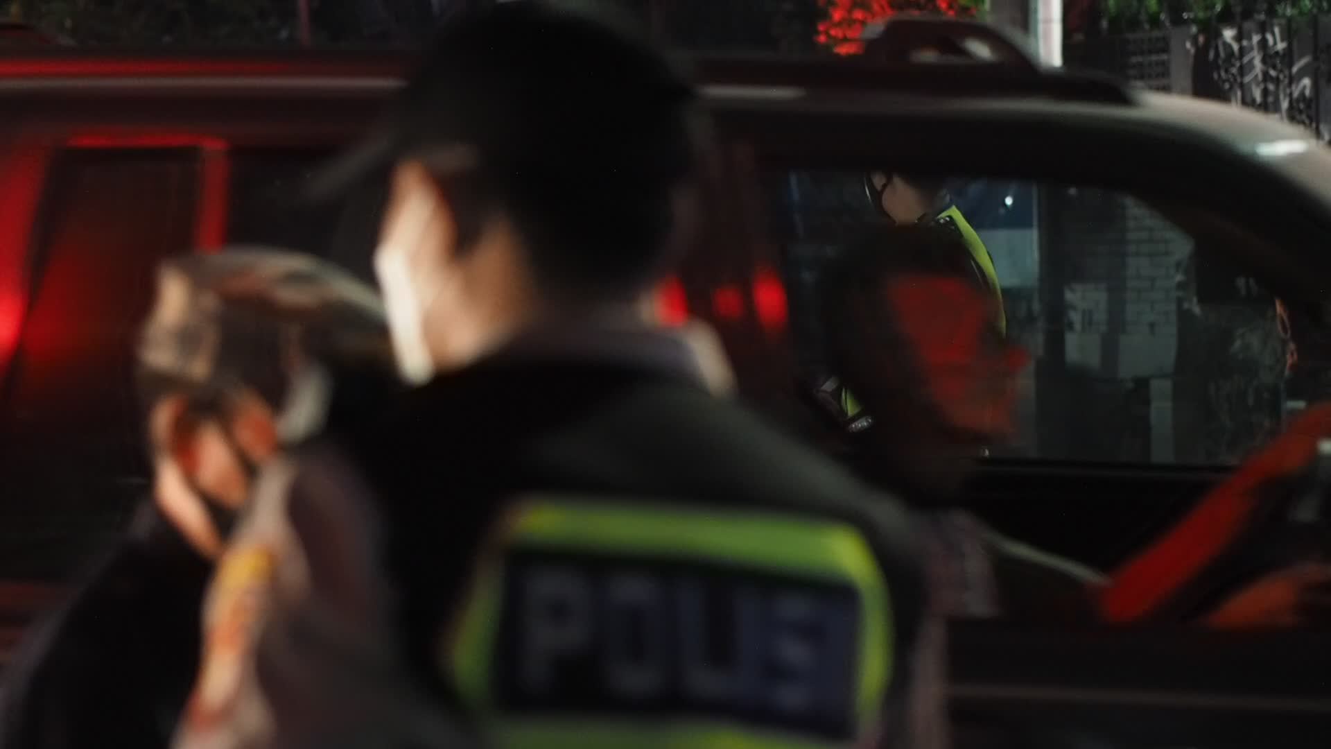 Police restrict the mobility of citizens amid the Covid-19 outbreak in Indonesia