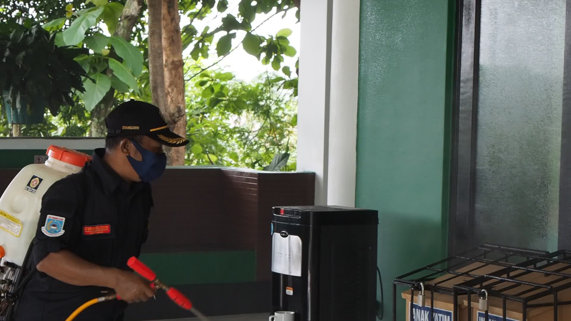 Officers Spray Disinfectant To Prevent The spread of COVID-19