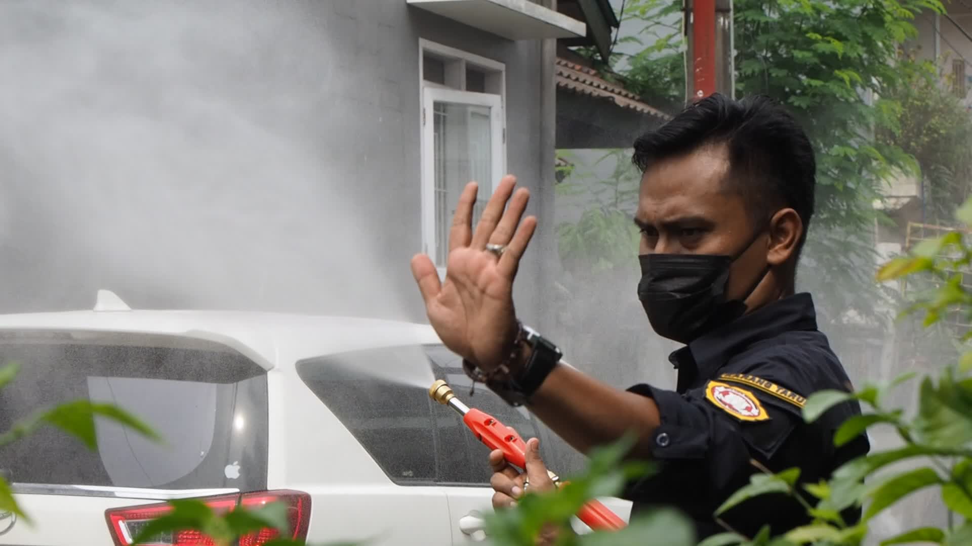 Officers Spray Disinfectant To Prevent The spread of COVID-19