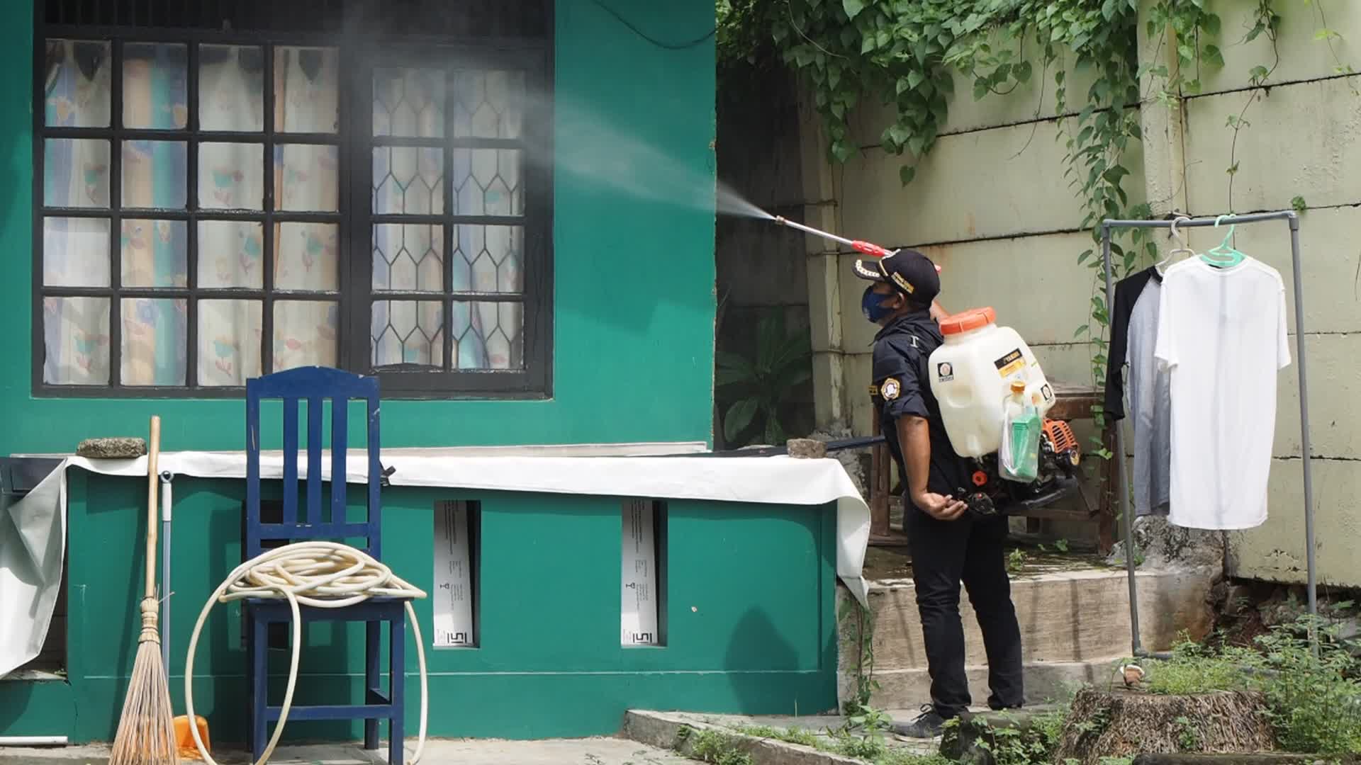 Officers Spray Disinfectant To Prevent The spread of COVID-19