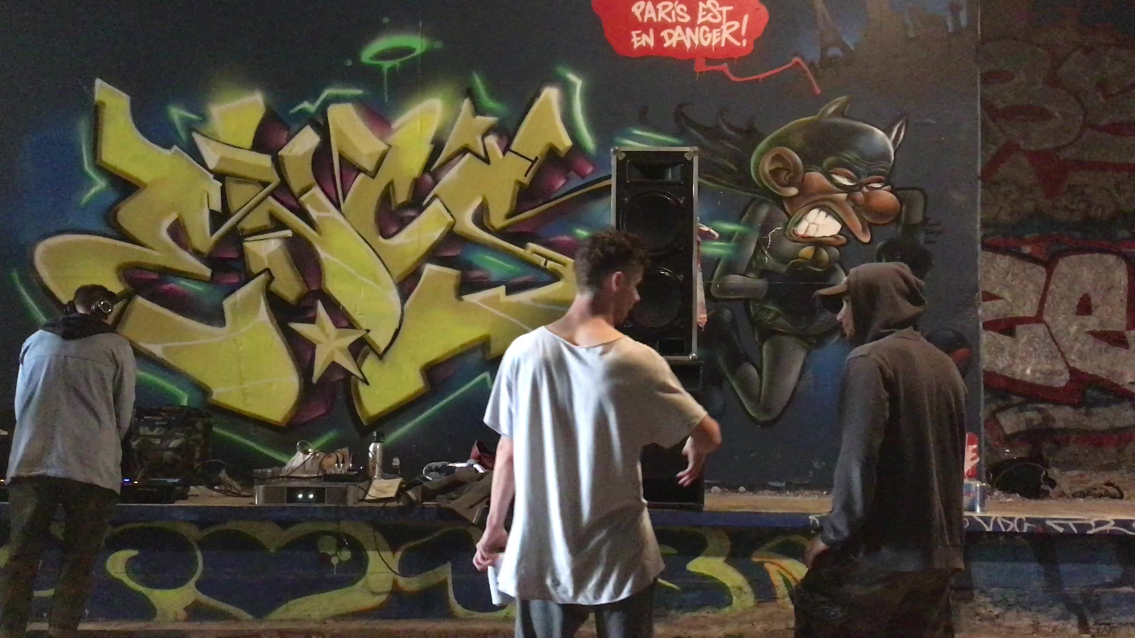 Young people partying in a tunnel old rails in Paris