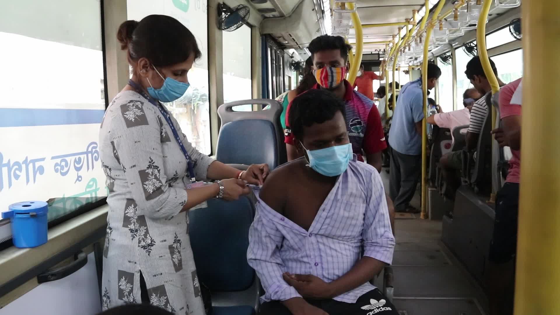 Coronavirus vaccination in a bus in India
